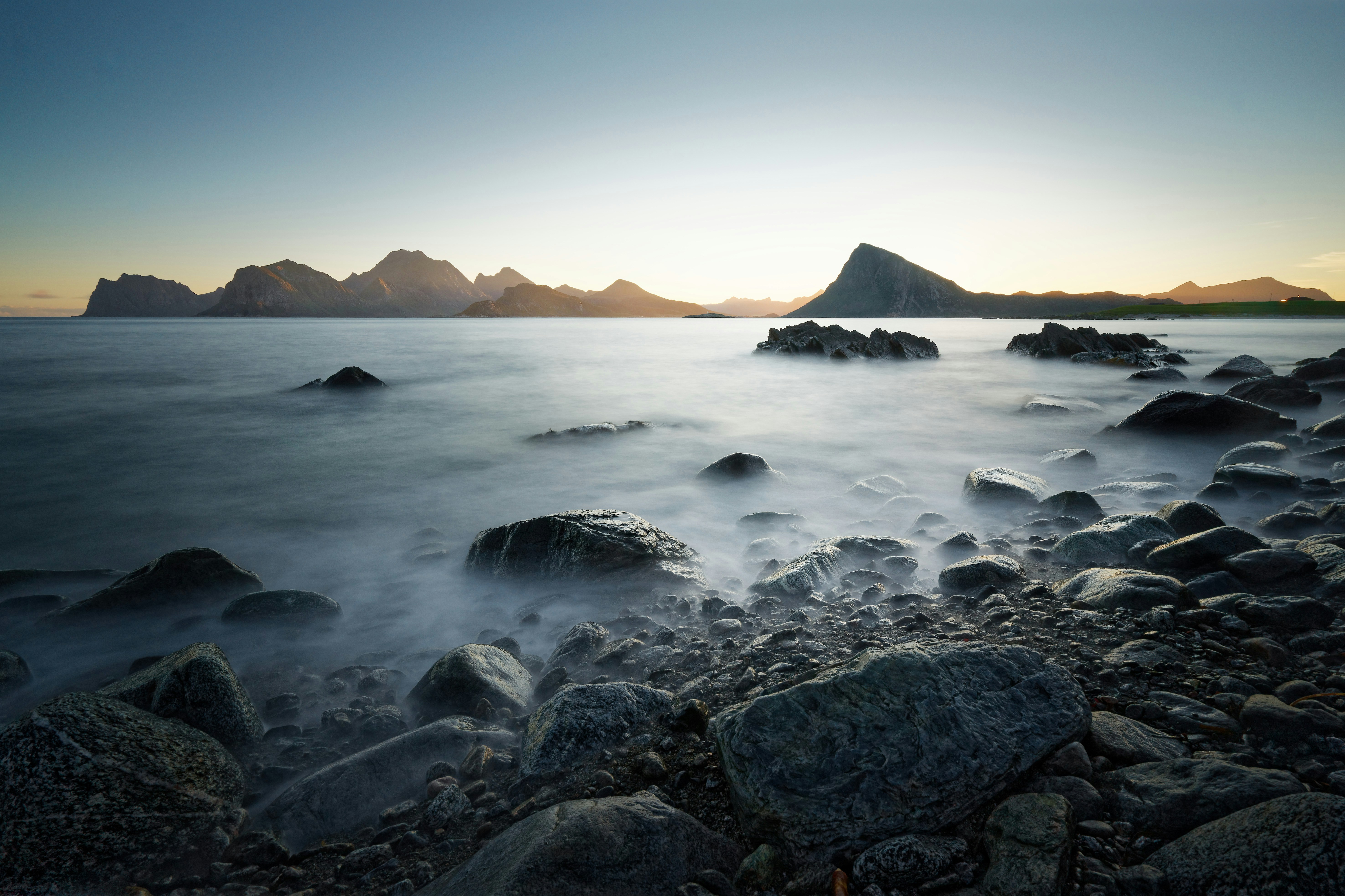 Rocky Coastal Seascape with Distant Mountains