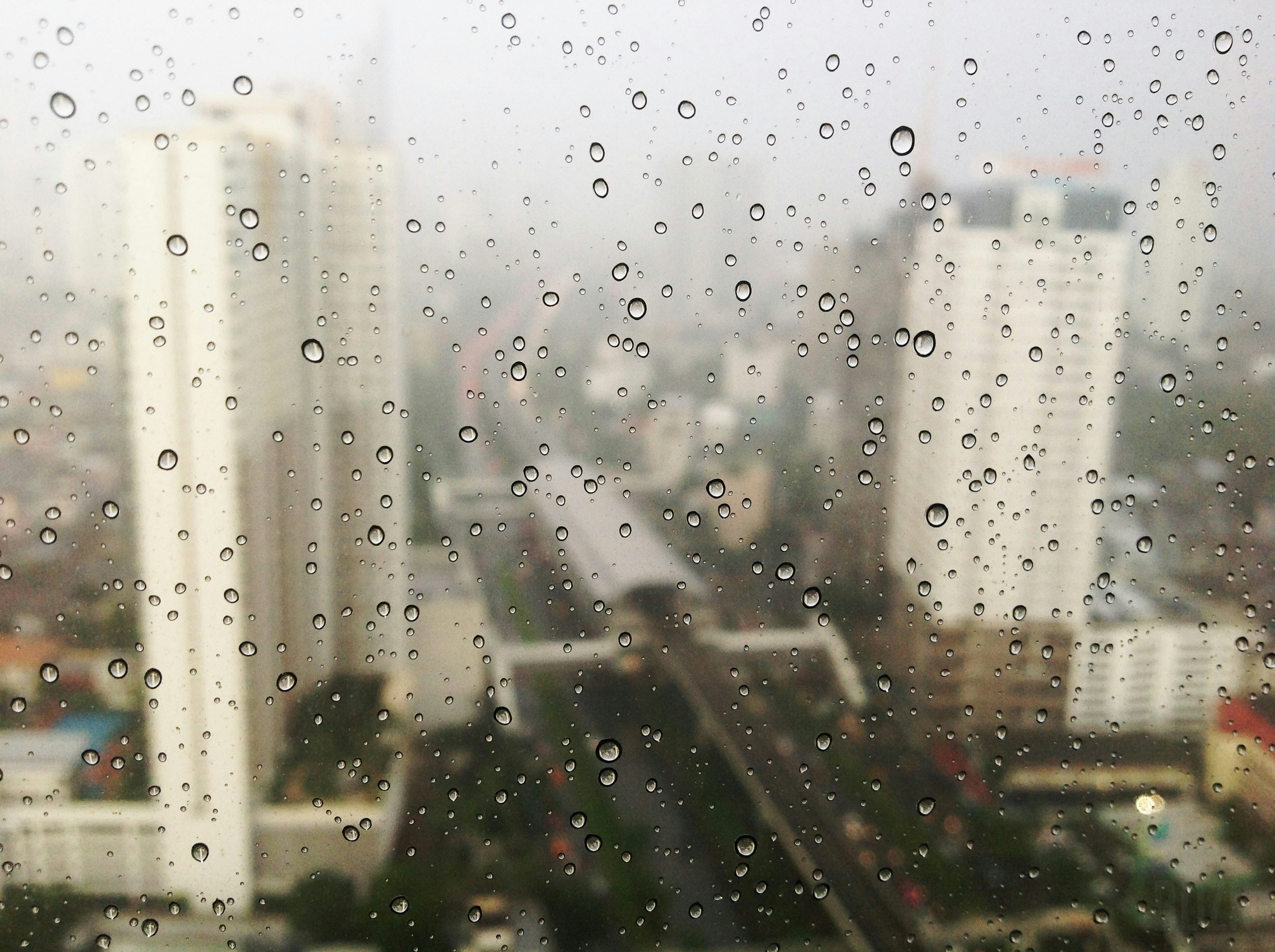 Rainy City View Through Window