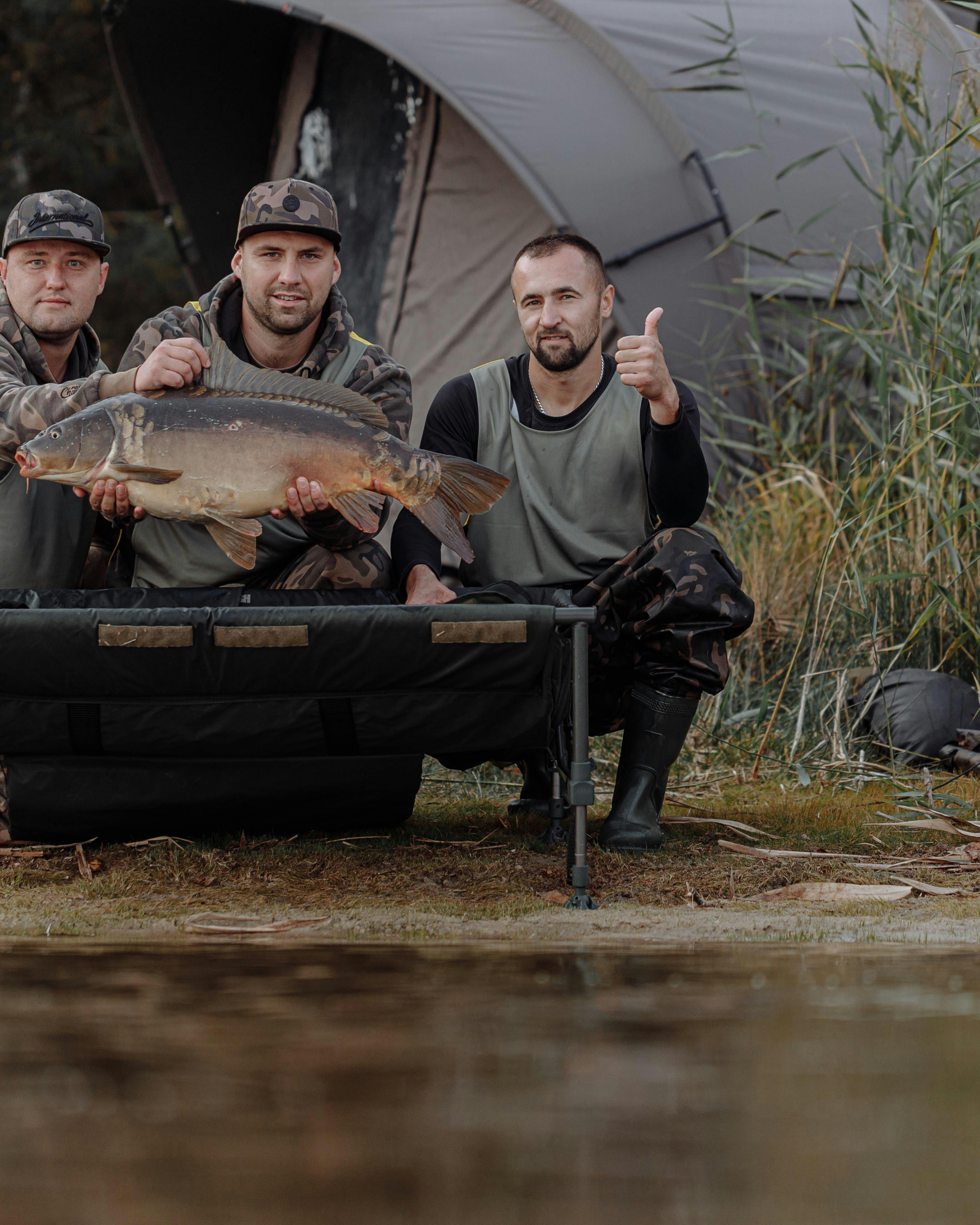 Three Anglers with Big Carp Catch