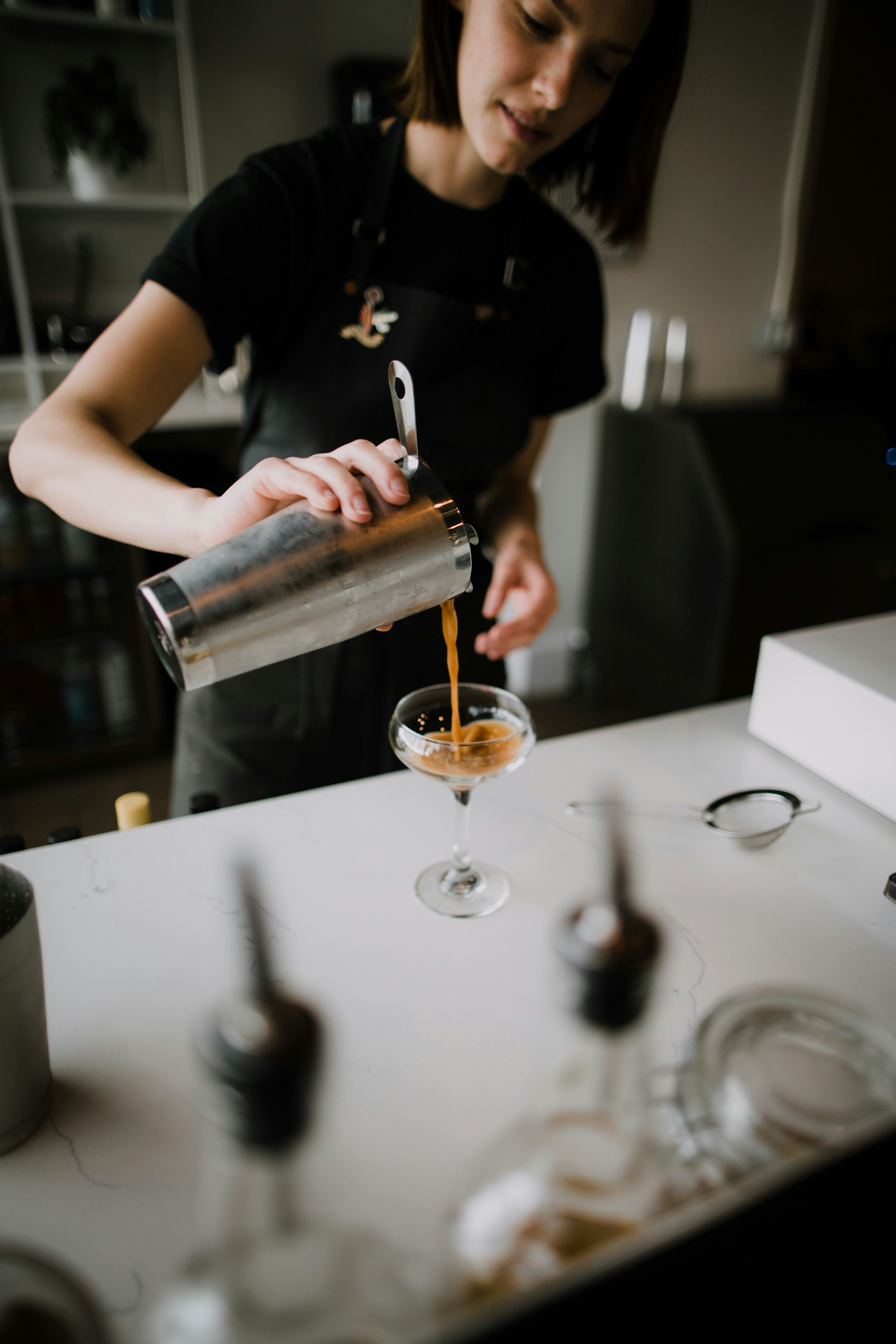 Bartender Pouring Finished Cocktail