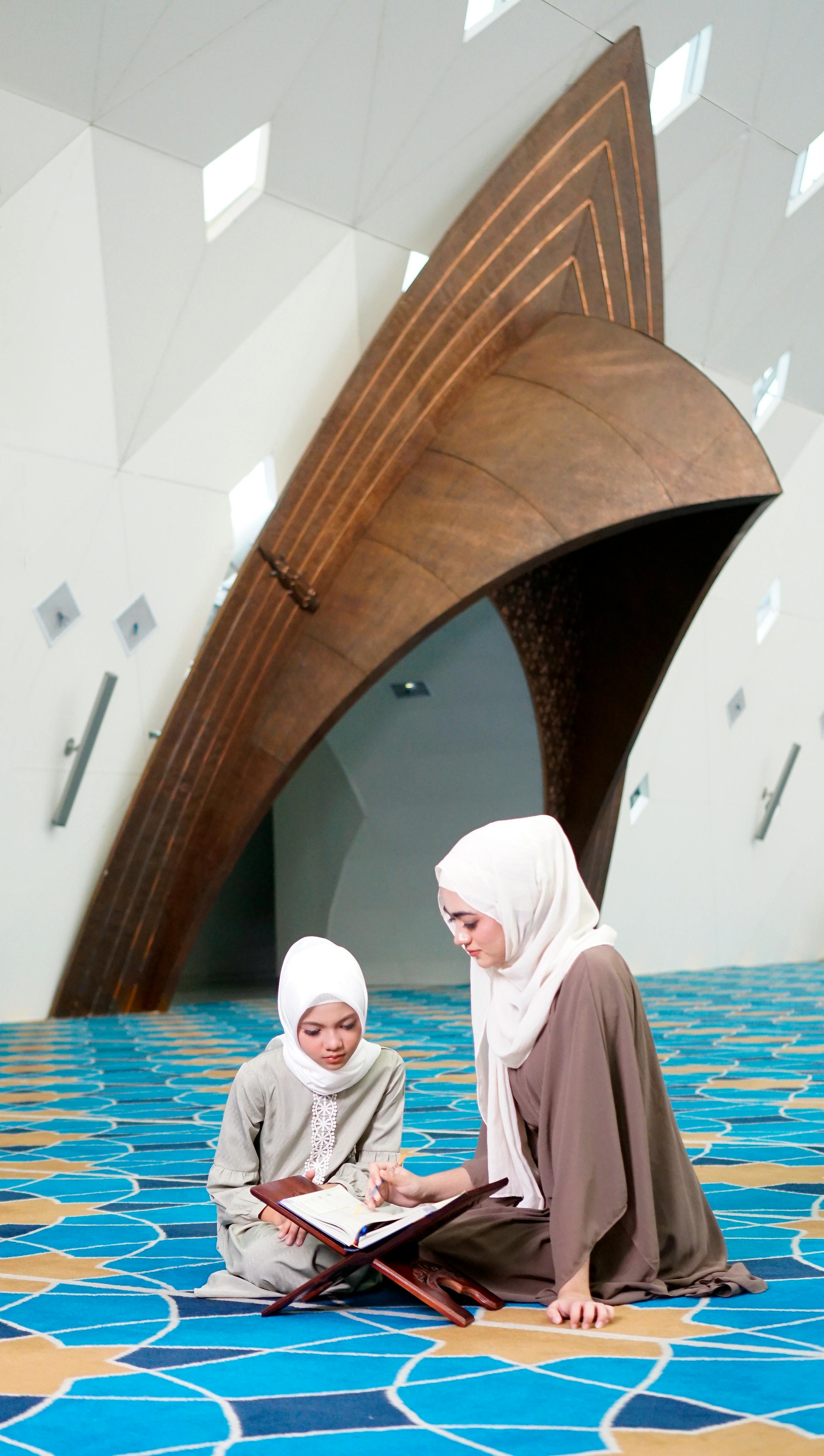 Two Women Studying Quran In Mosque