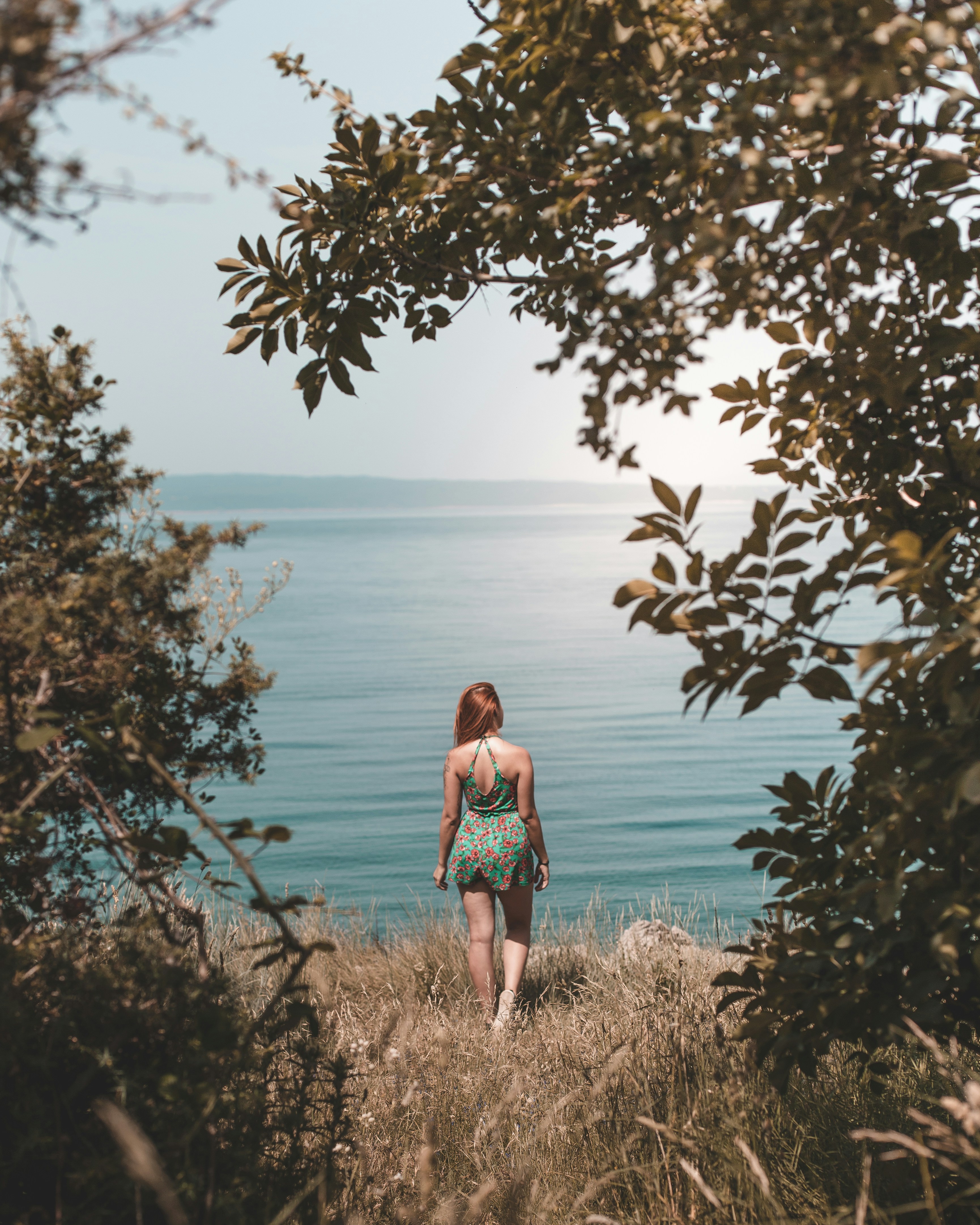 Woman Overlooking Calm Sea