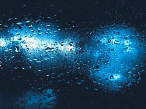 Raindrops on Glass at Night