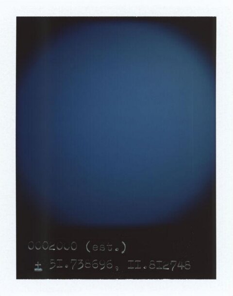 Blue Polaroid with Geographic Coordinates