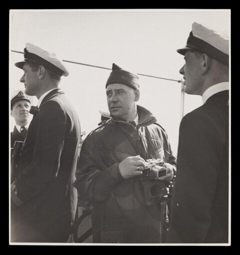 Naval Officers with Photographer on Deck
