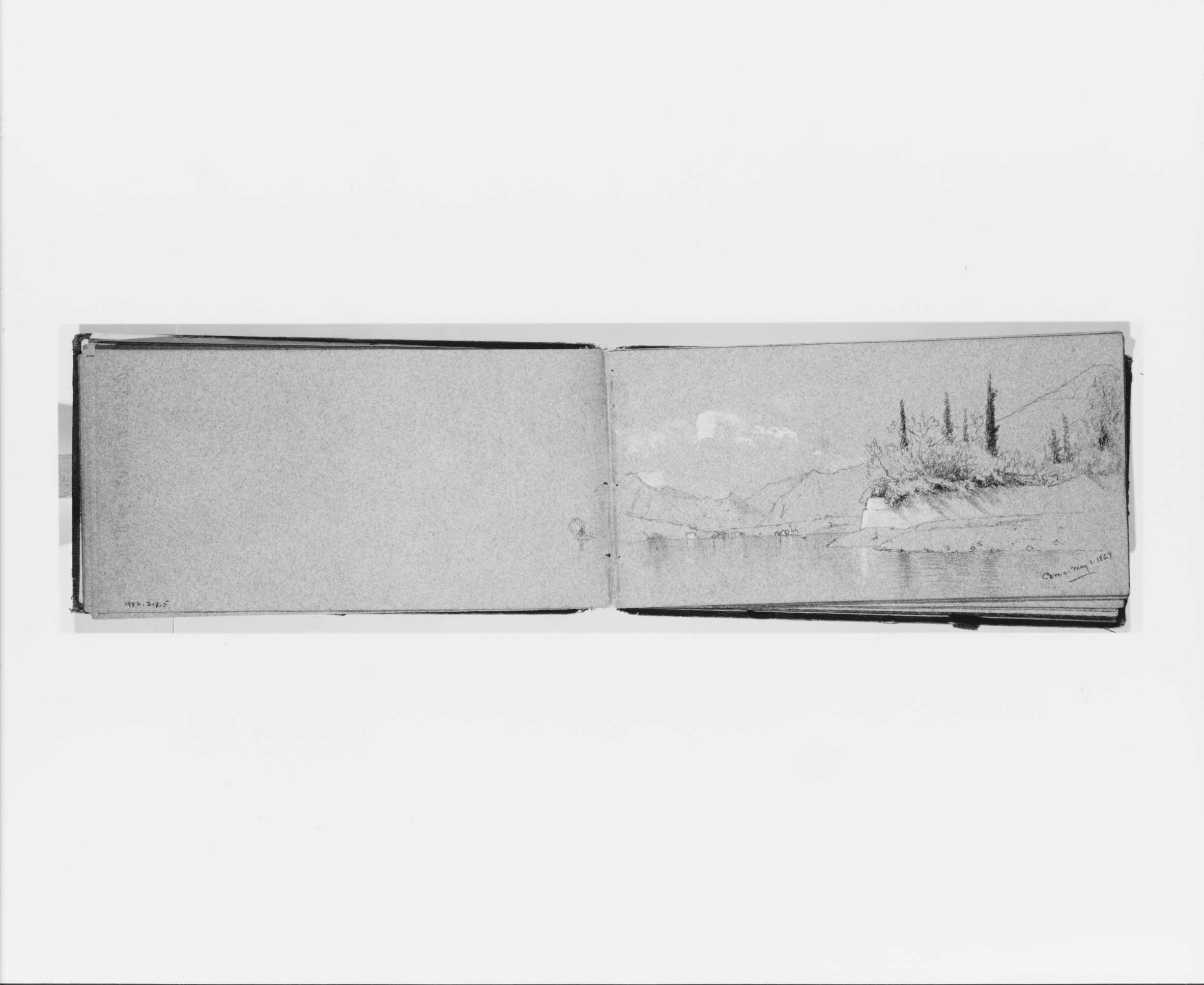 Open Sketchbook with Lake Landscape Sketch