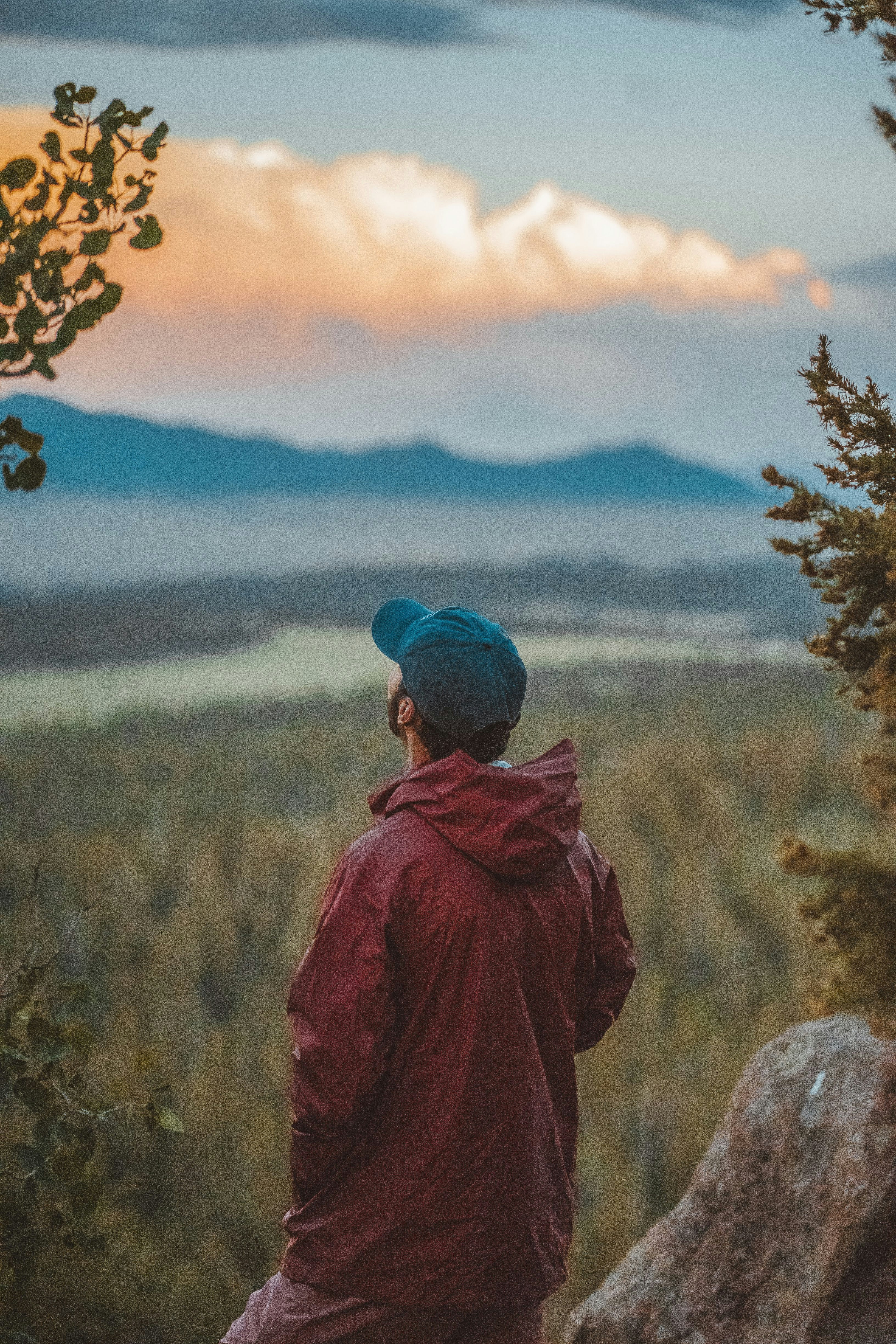 Hiker Overlooks Valley at Sunset