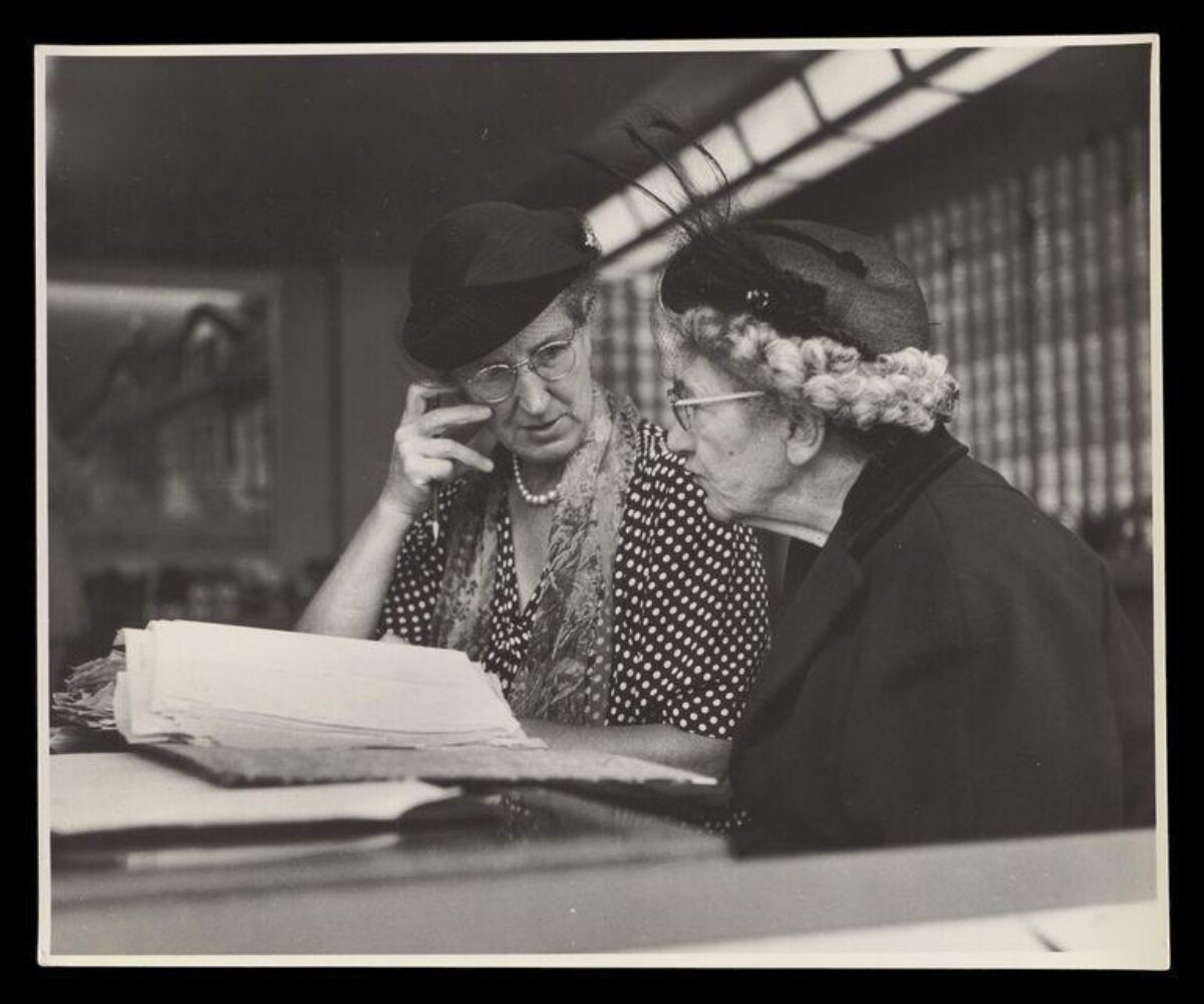 Two Elderly Women Checking Documents