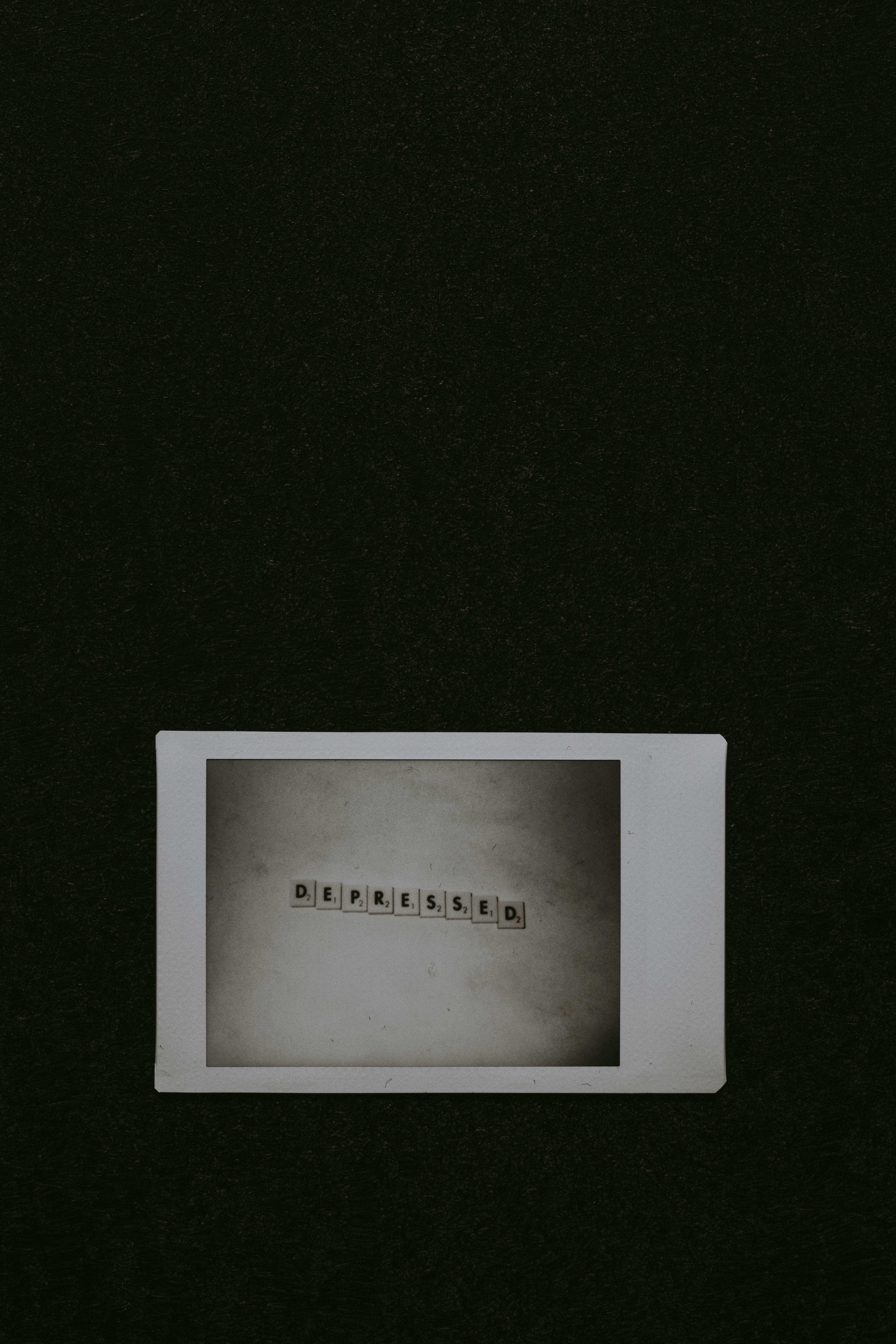 DEPRESSED Word on Polaroid Photo