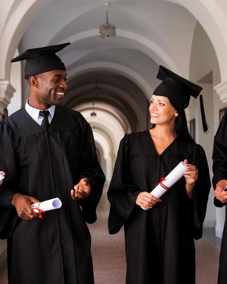 Happy Graduates Holding Diplomas
