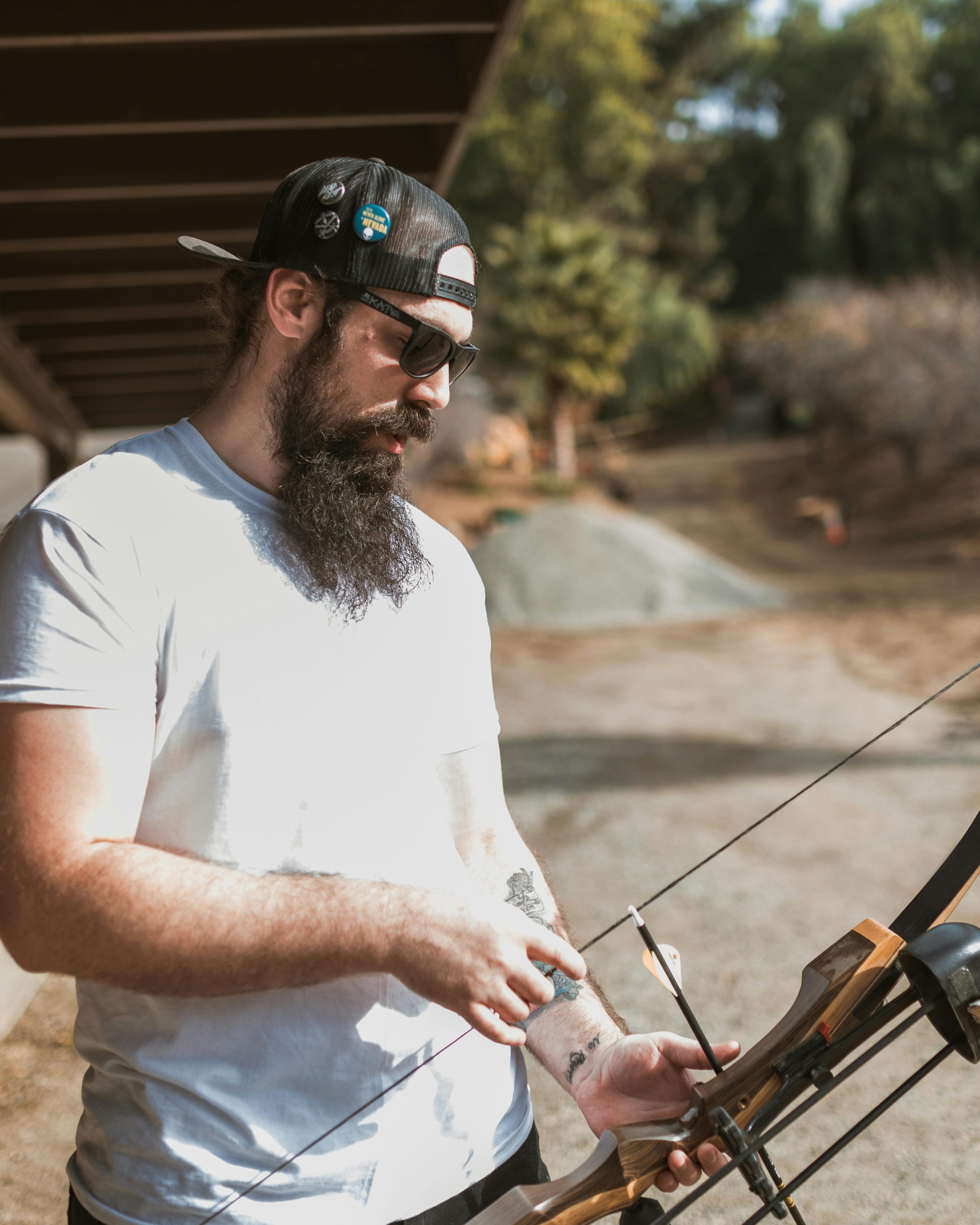 Man Preparing Archery Bow