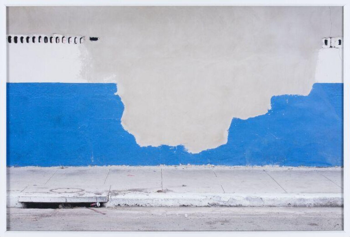 Peeling Blue Paint on Street Wall