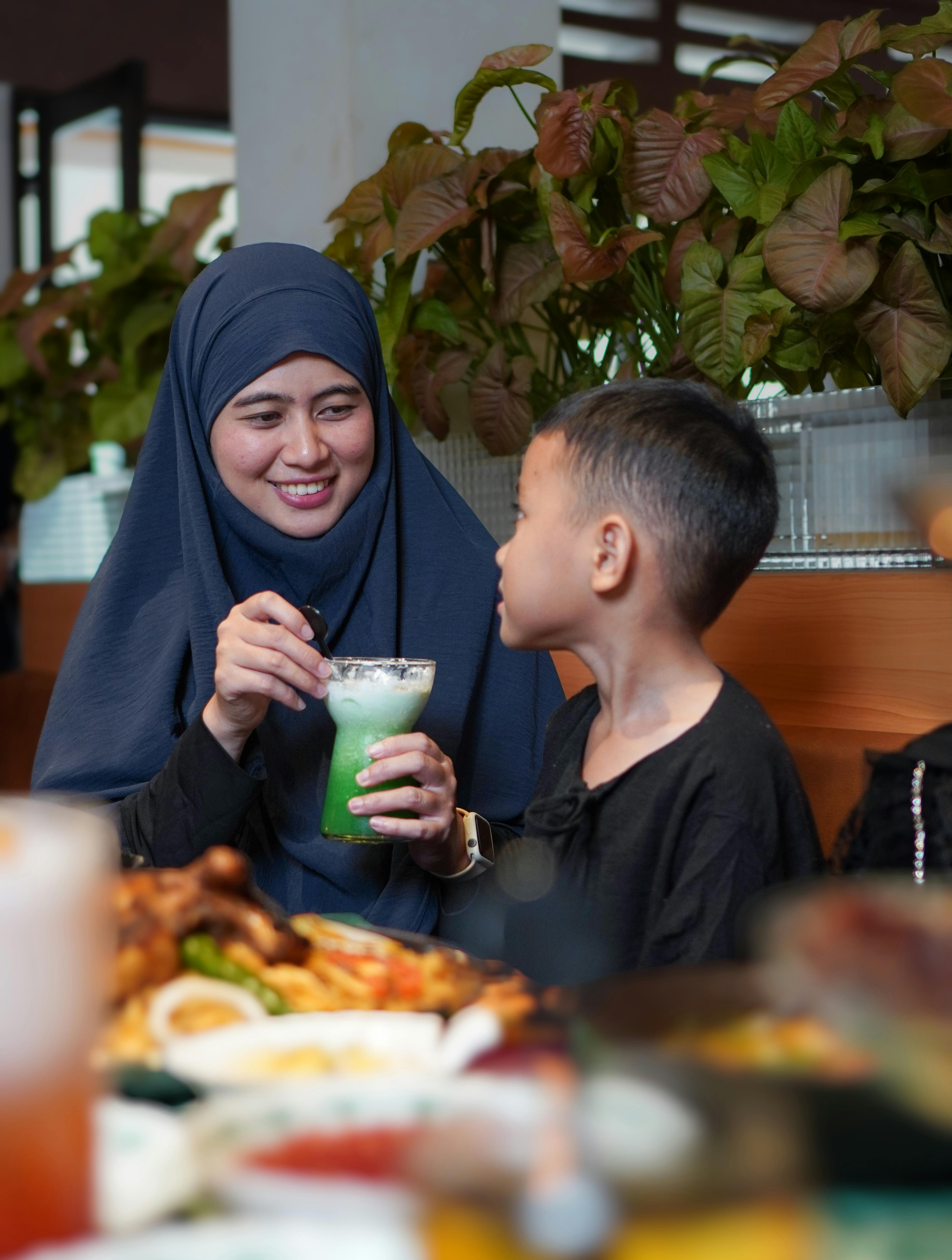 Mother and Son Dining at Restaurant