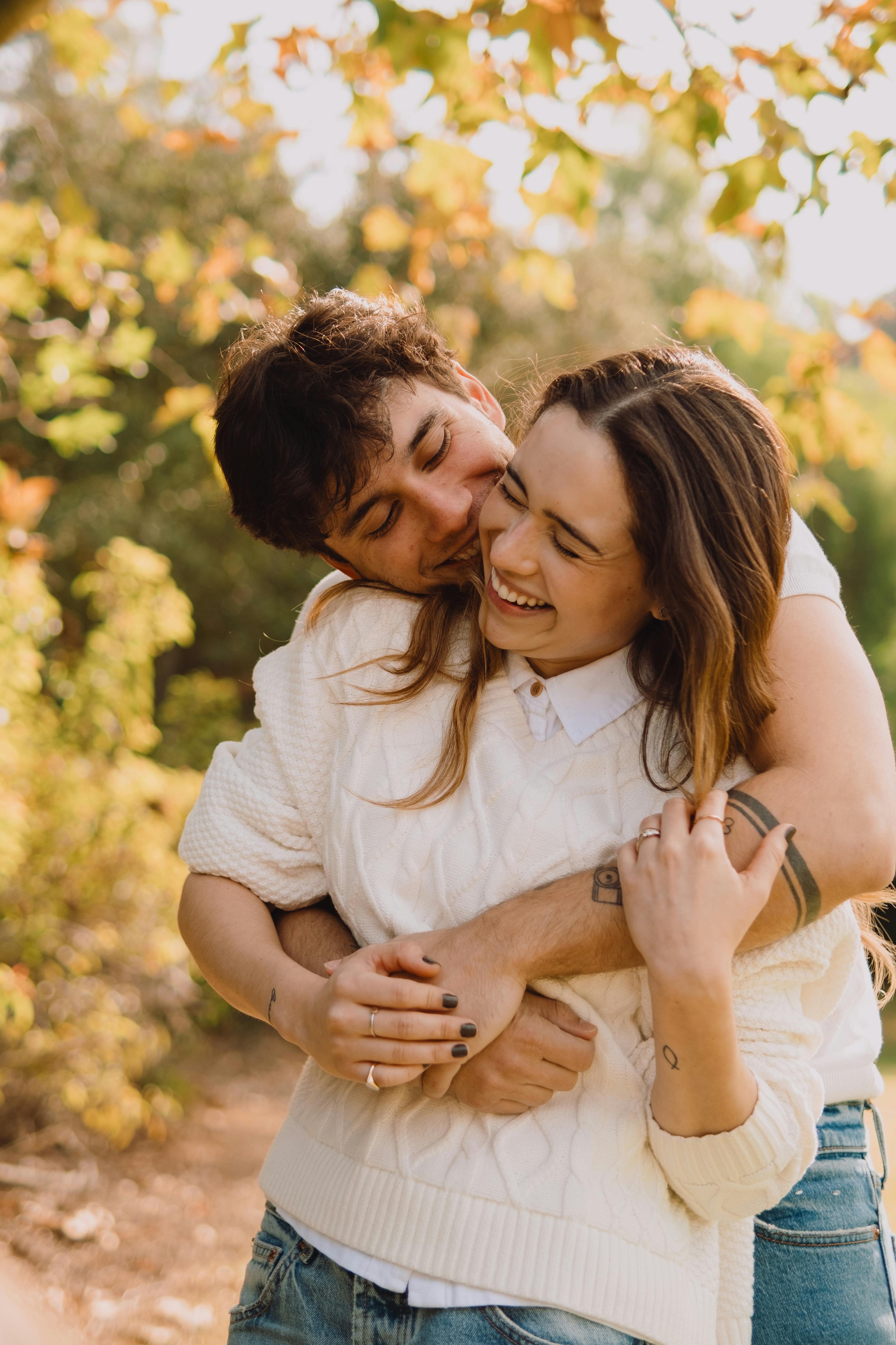 Happy Couple Hugging in Autumn Park