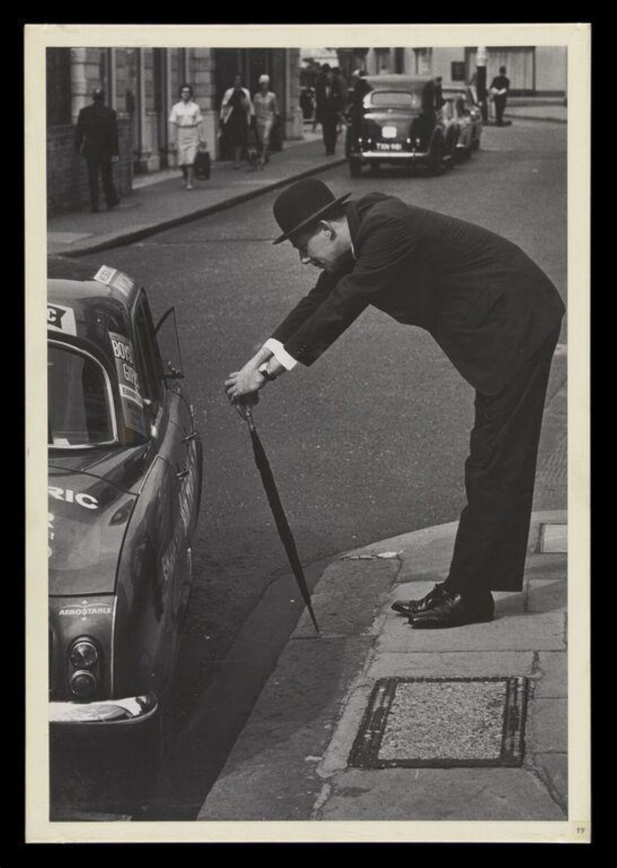 Gentleman Checking Parked Vintage Car