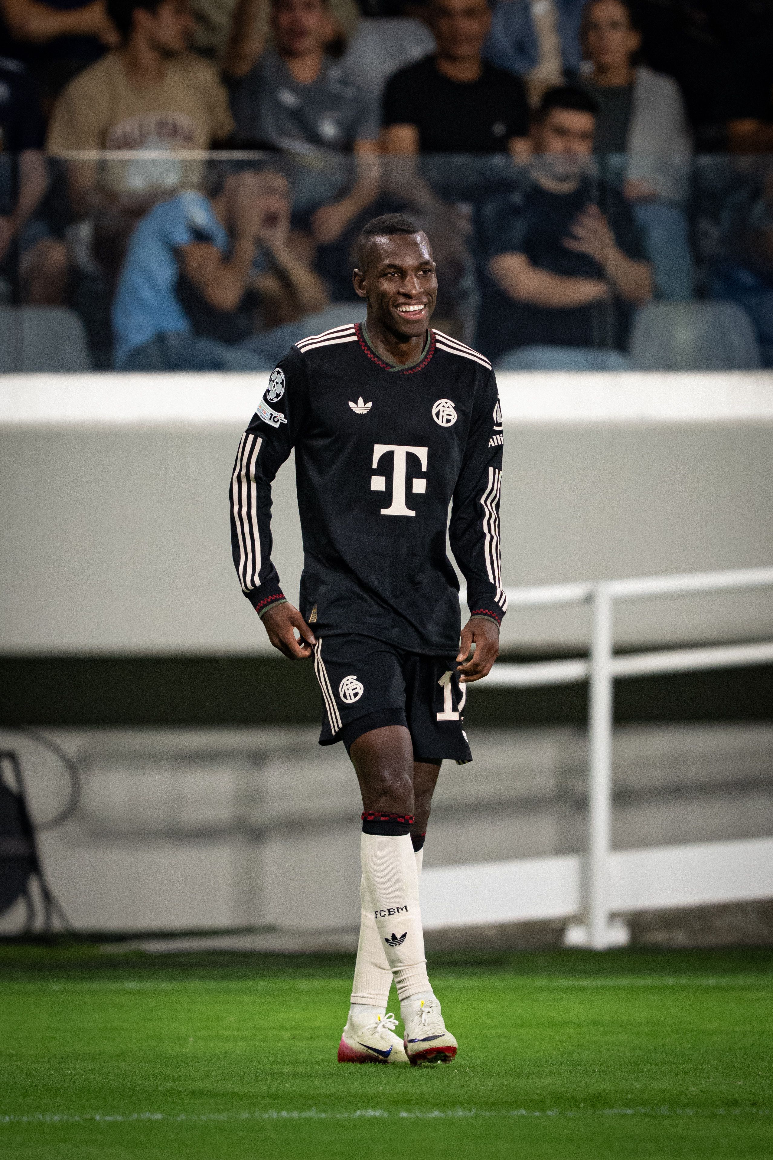 Smiling Bayern Munich Footballer on Pitch