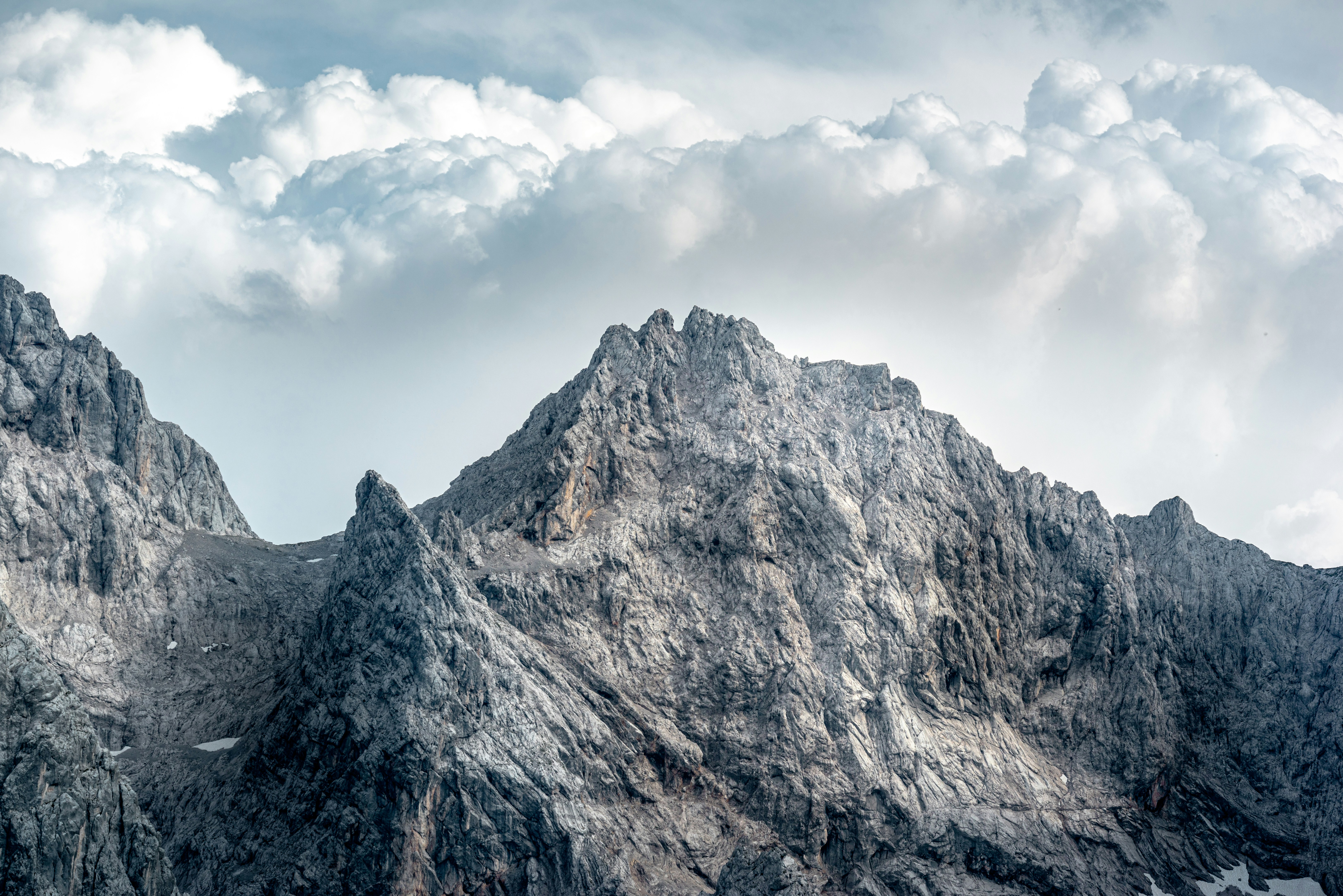 Rocky Mountain Peaks Under Cloudy Sky