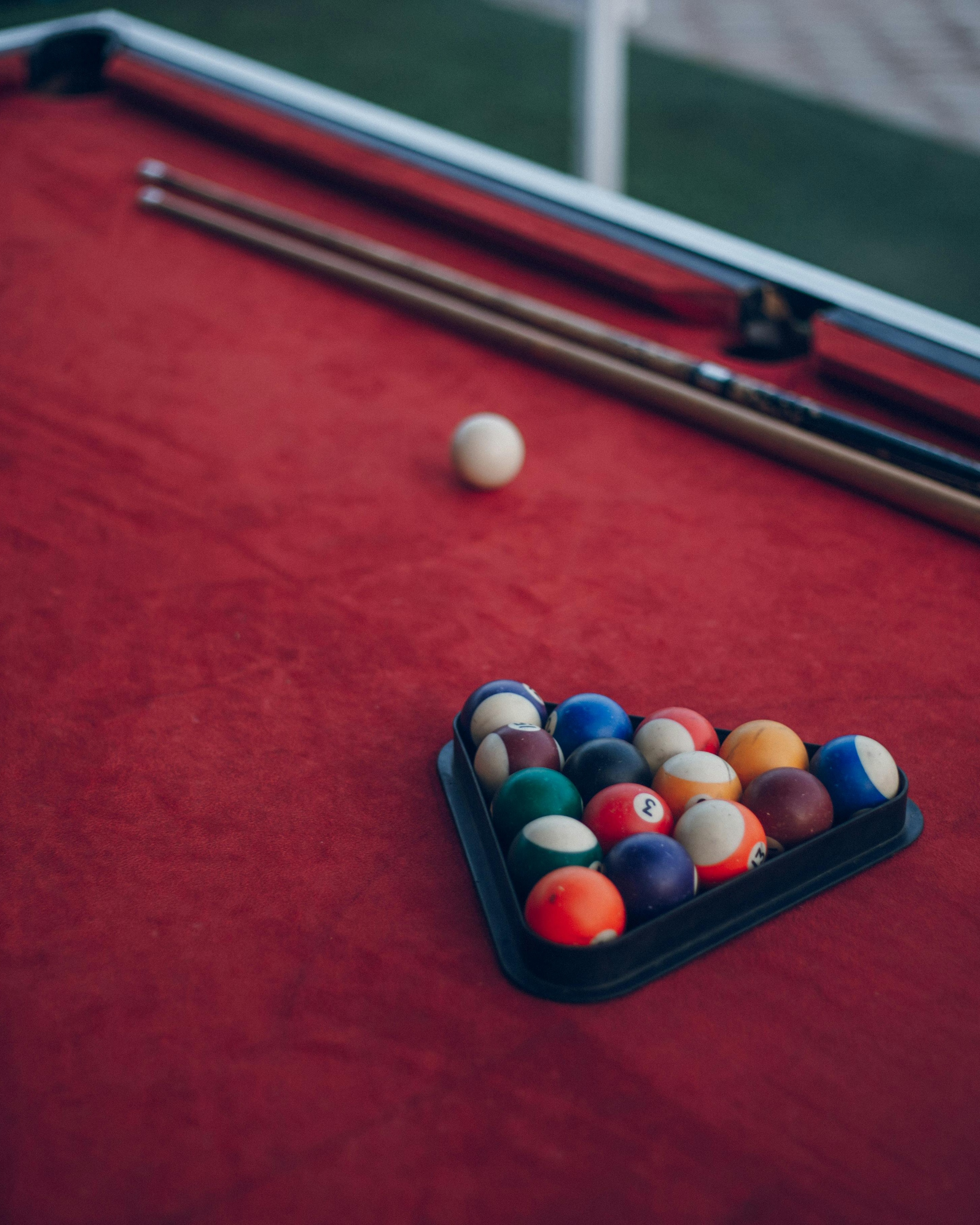 Racked Balls on Red Pool Table