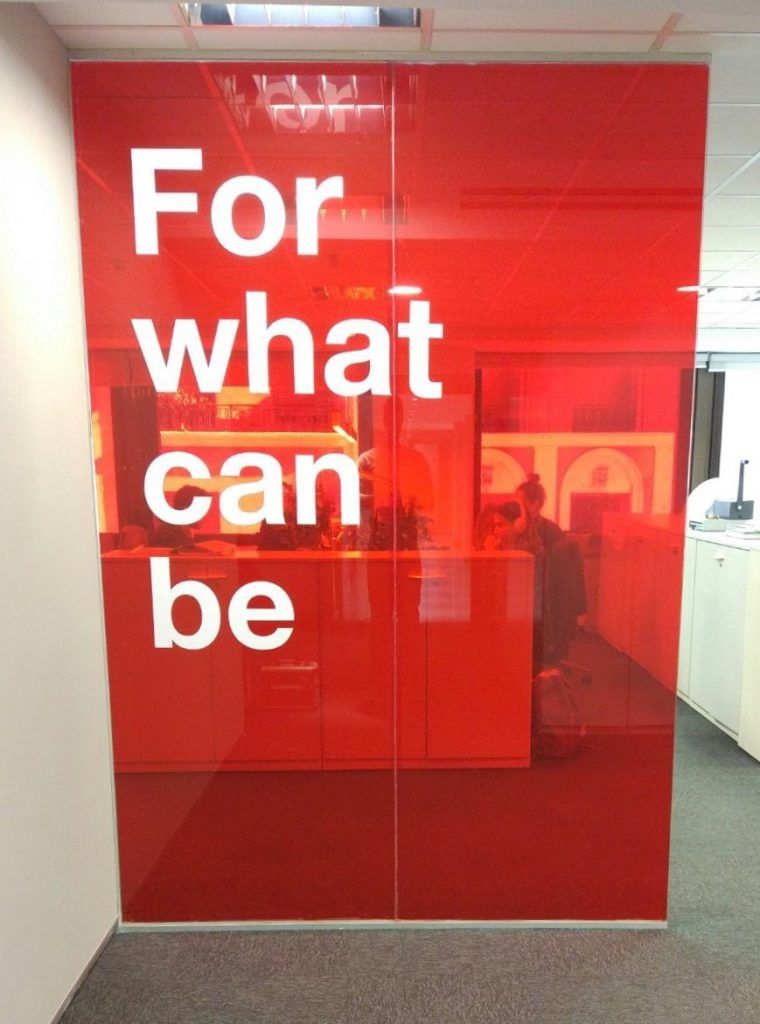 Split Text On Red Office Glass Partition