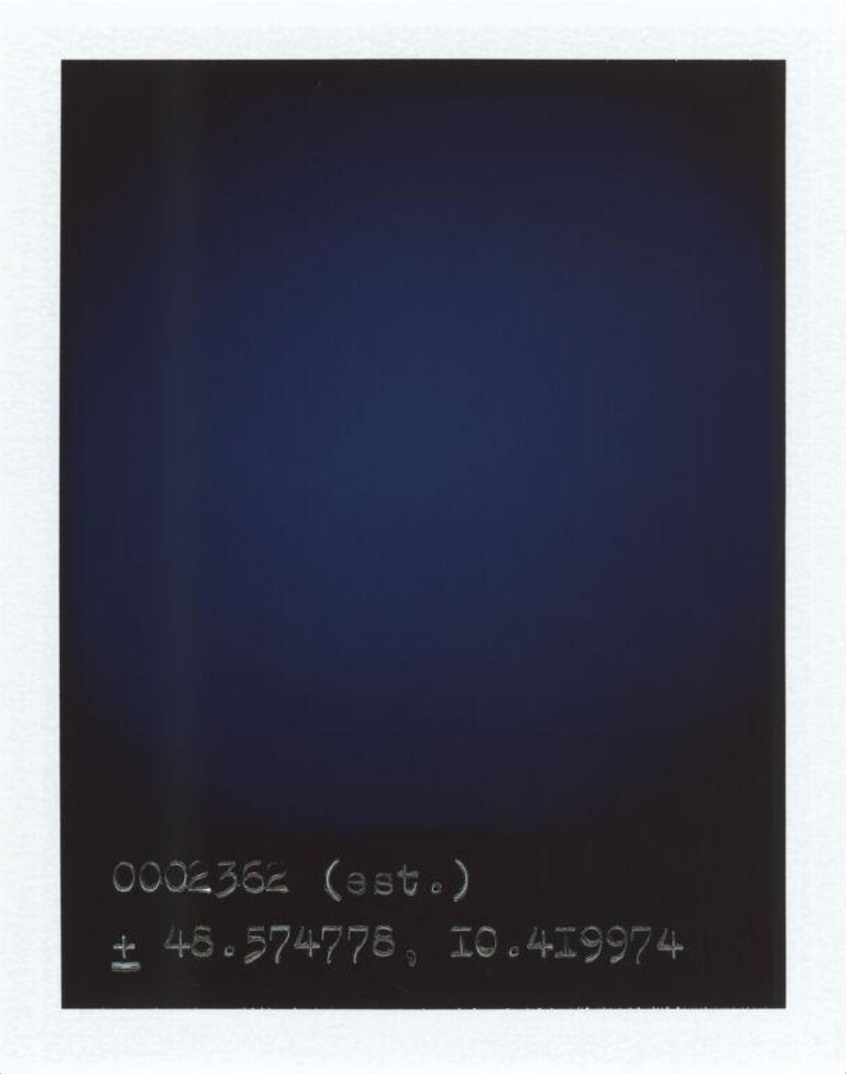 Handwritten Coordinates On Dark Polaroid