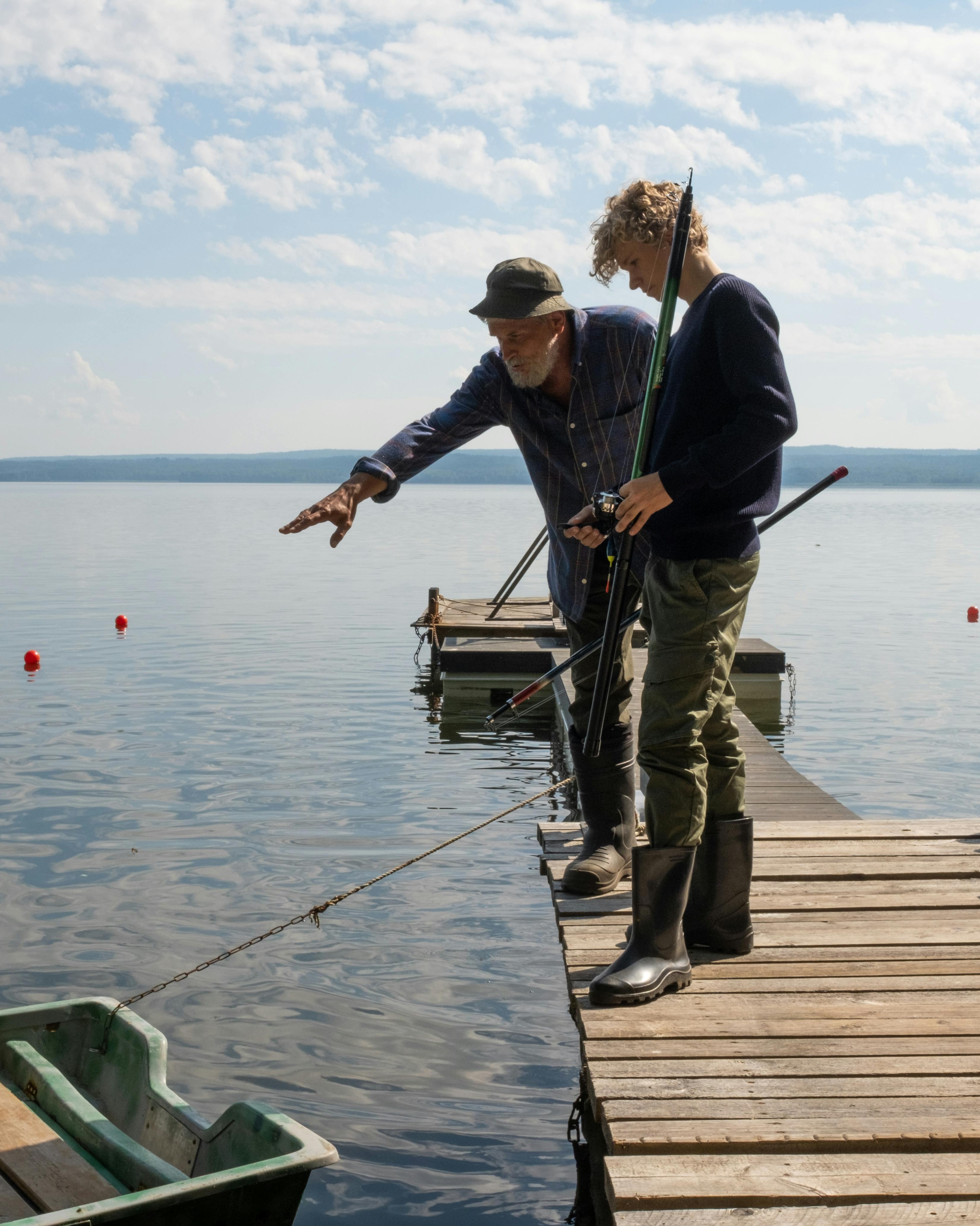 Two Men Fishing on Lake Dock