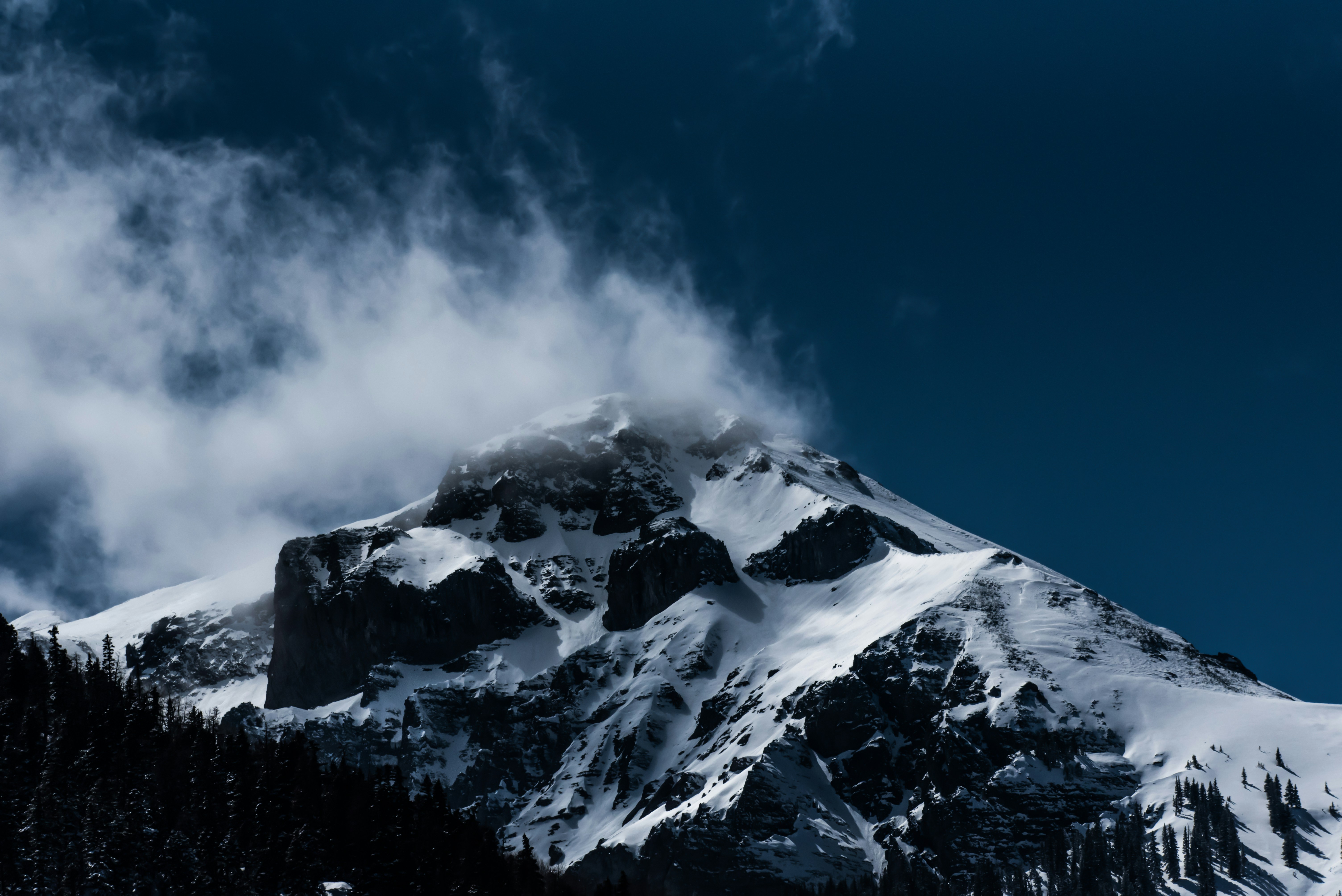 Snow-Capped Mountain Peak with Clouds