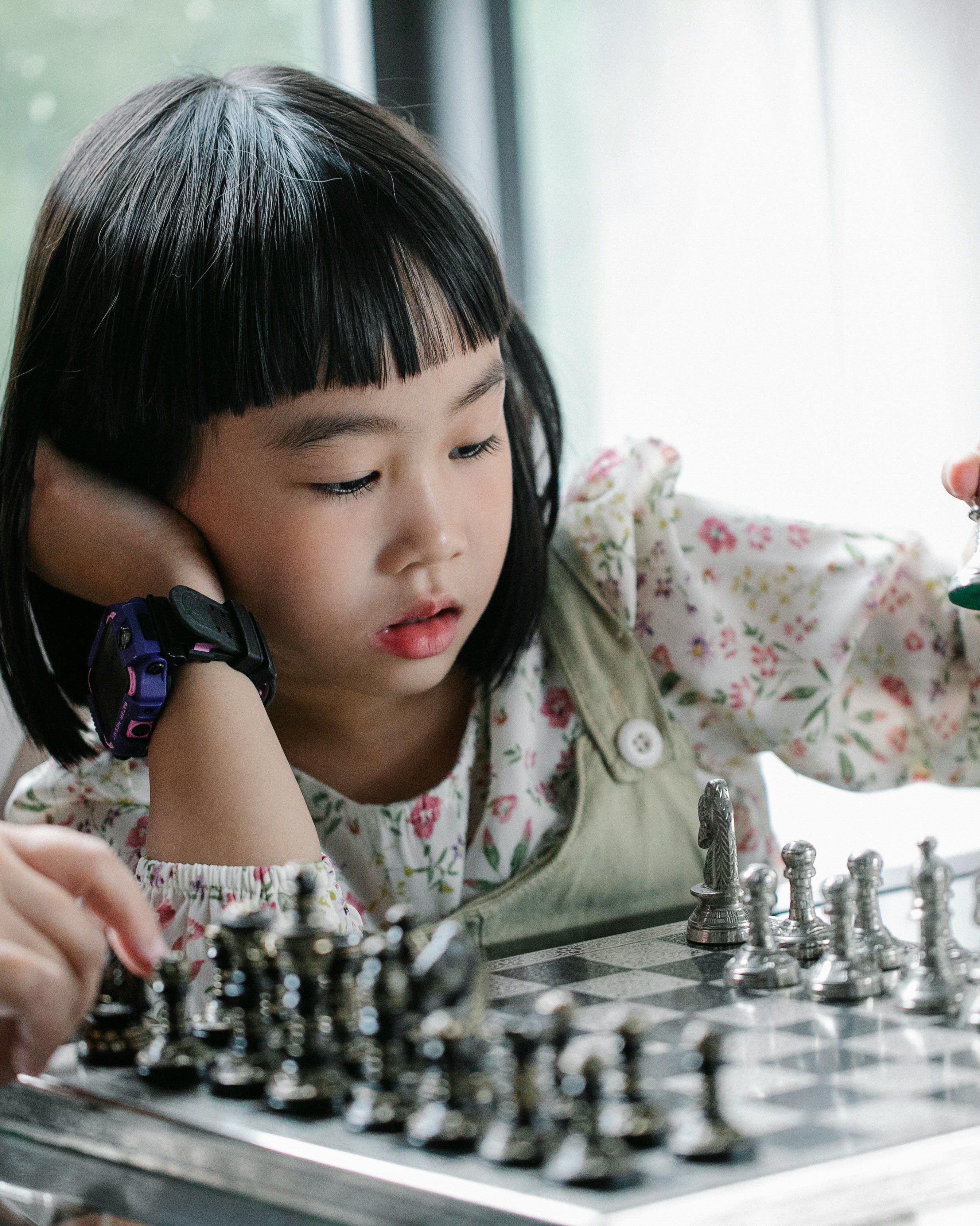 Young Girl Playing Chess