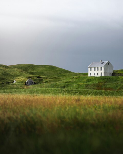 Isolated White House on Grassy Hills