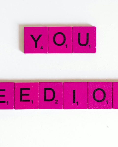 Pink Letter Tiles Spelling YOU