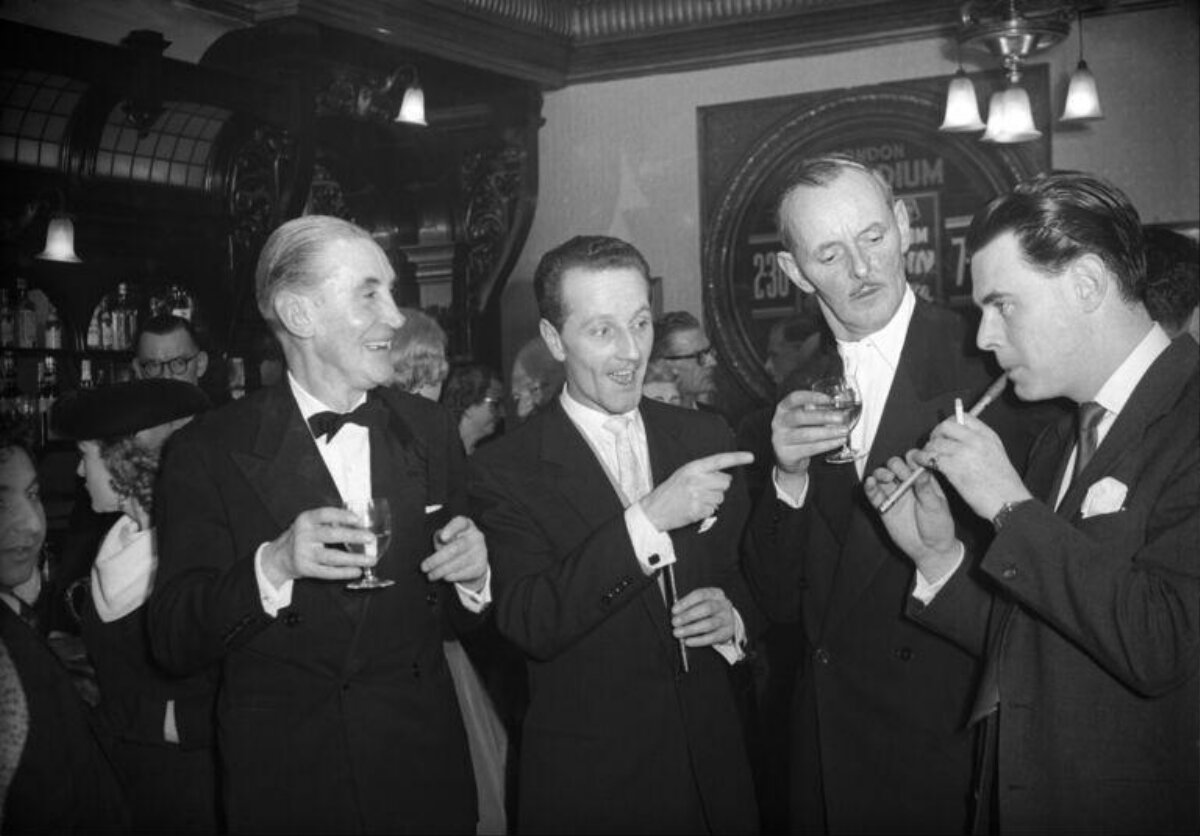 Four Men Socializing in Vintage Pub