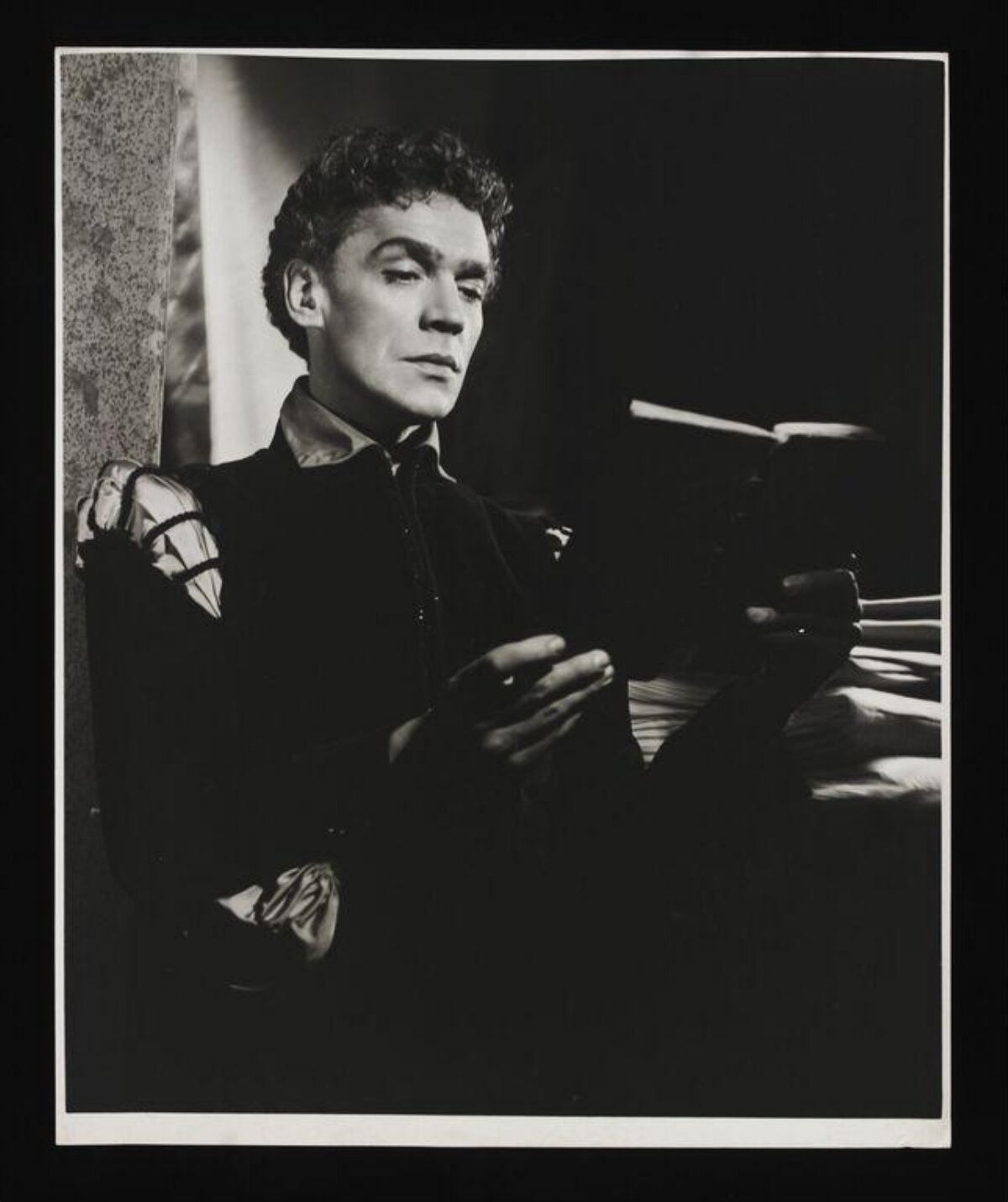 Stage Actor in Costume Reading a Book