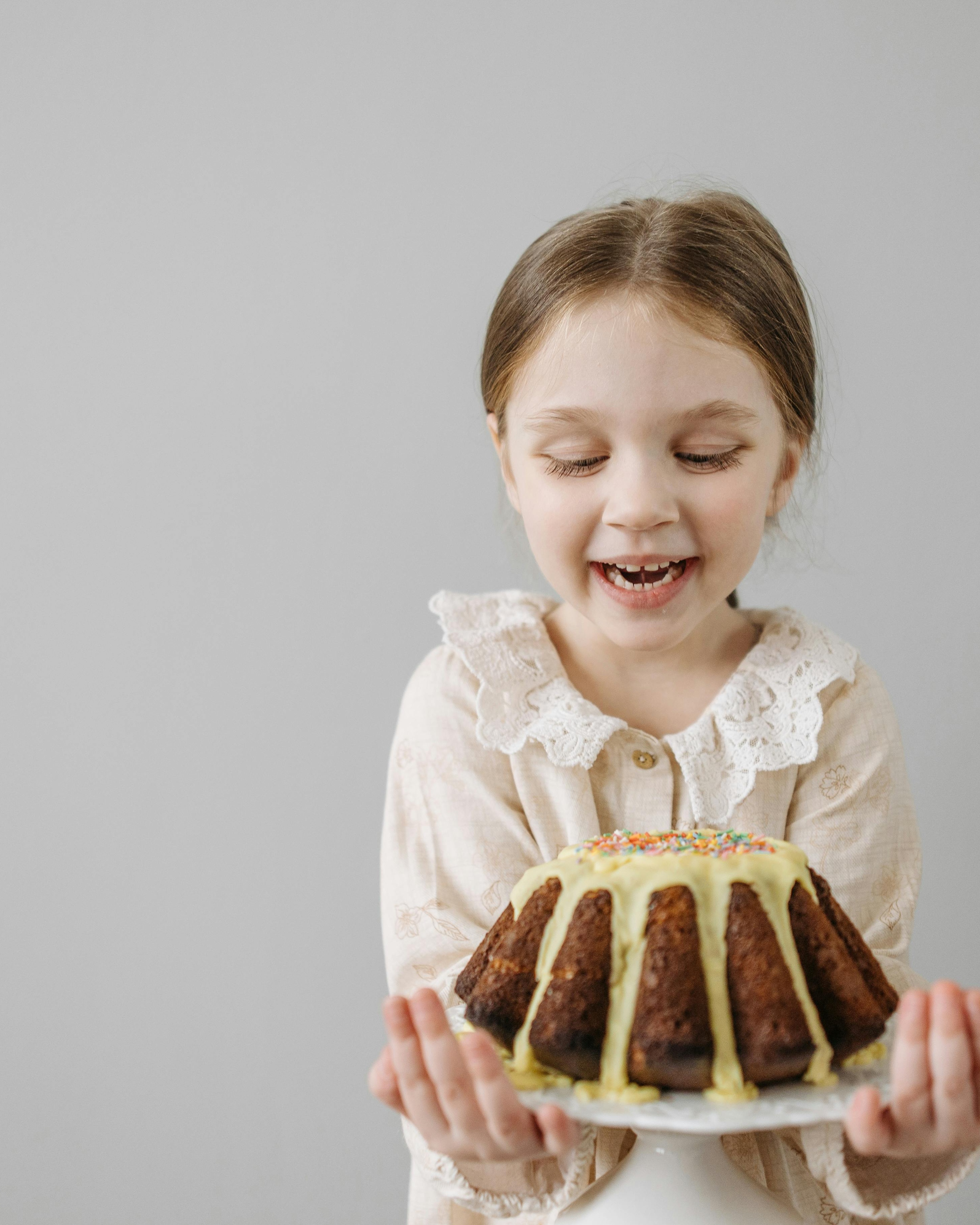 Happy Girl Holding Homemade Bundt Cake