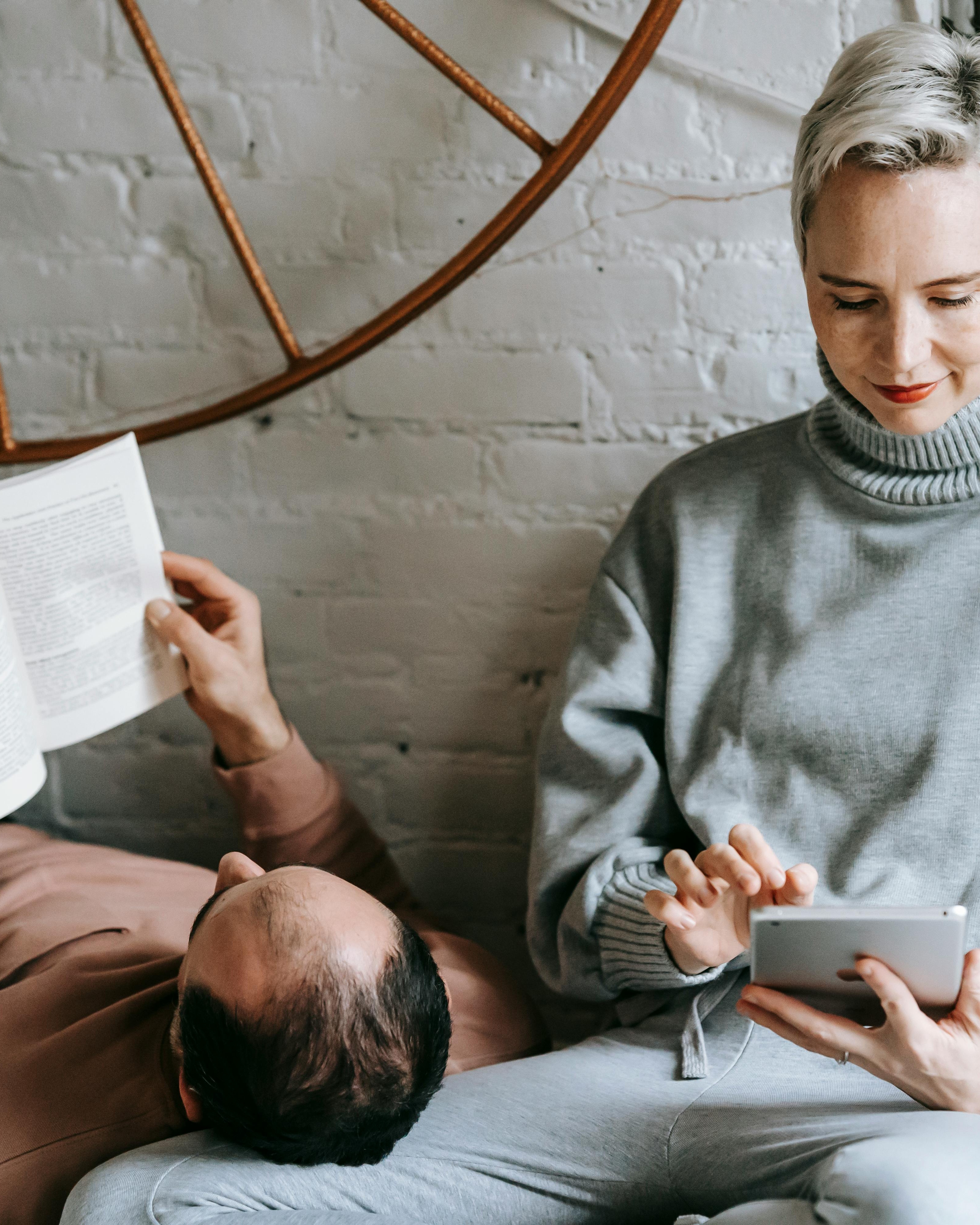 Couple Relaxing With Reading At Home