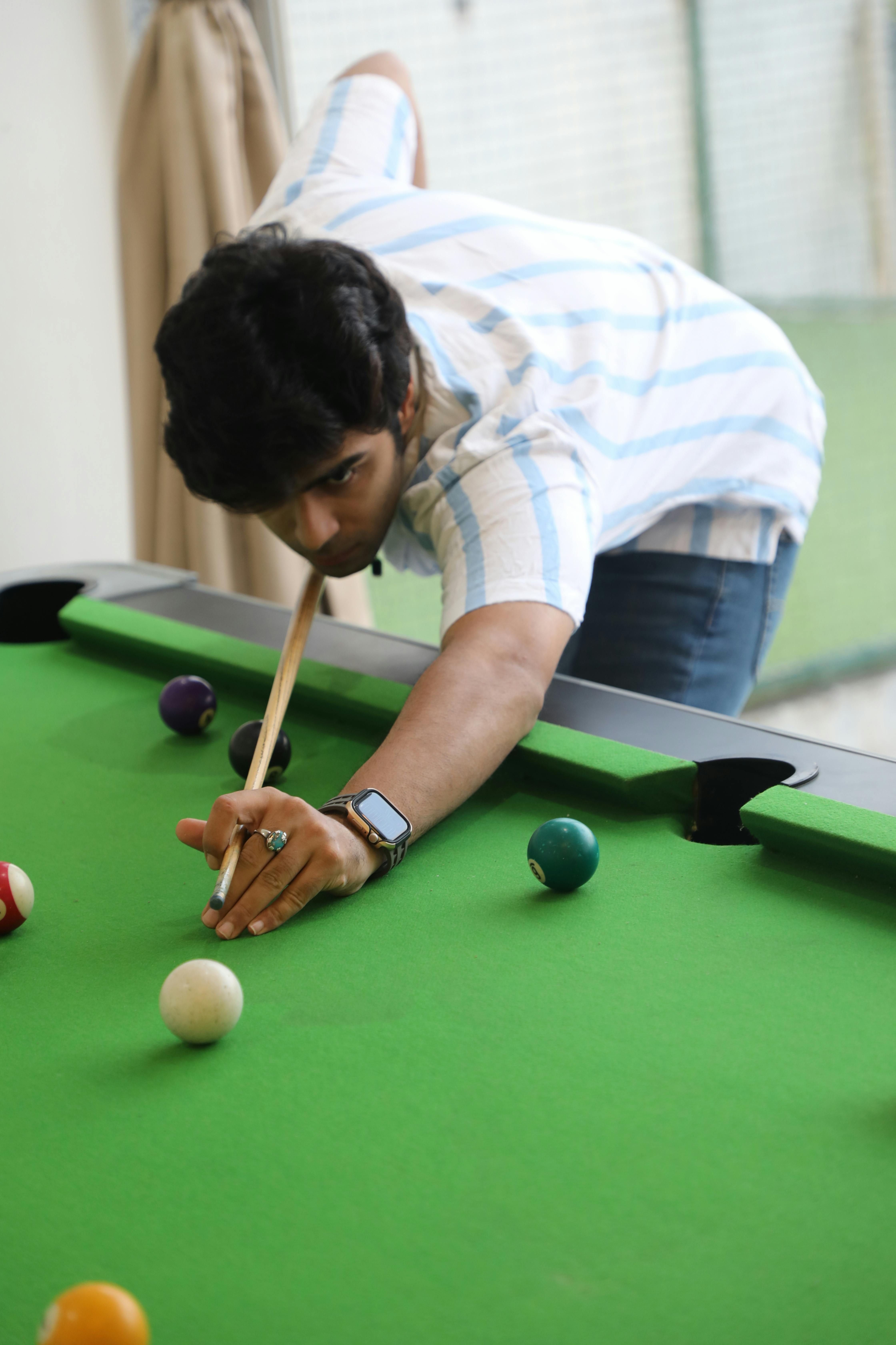 Young Man Playing Pool