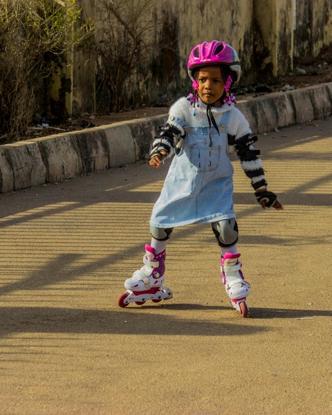 Young Girl Roller Skating Outdoors