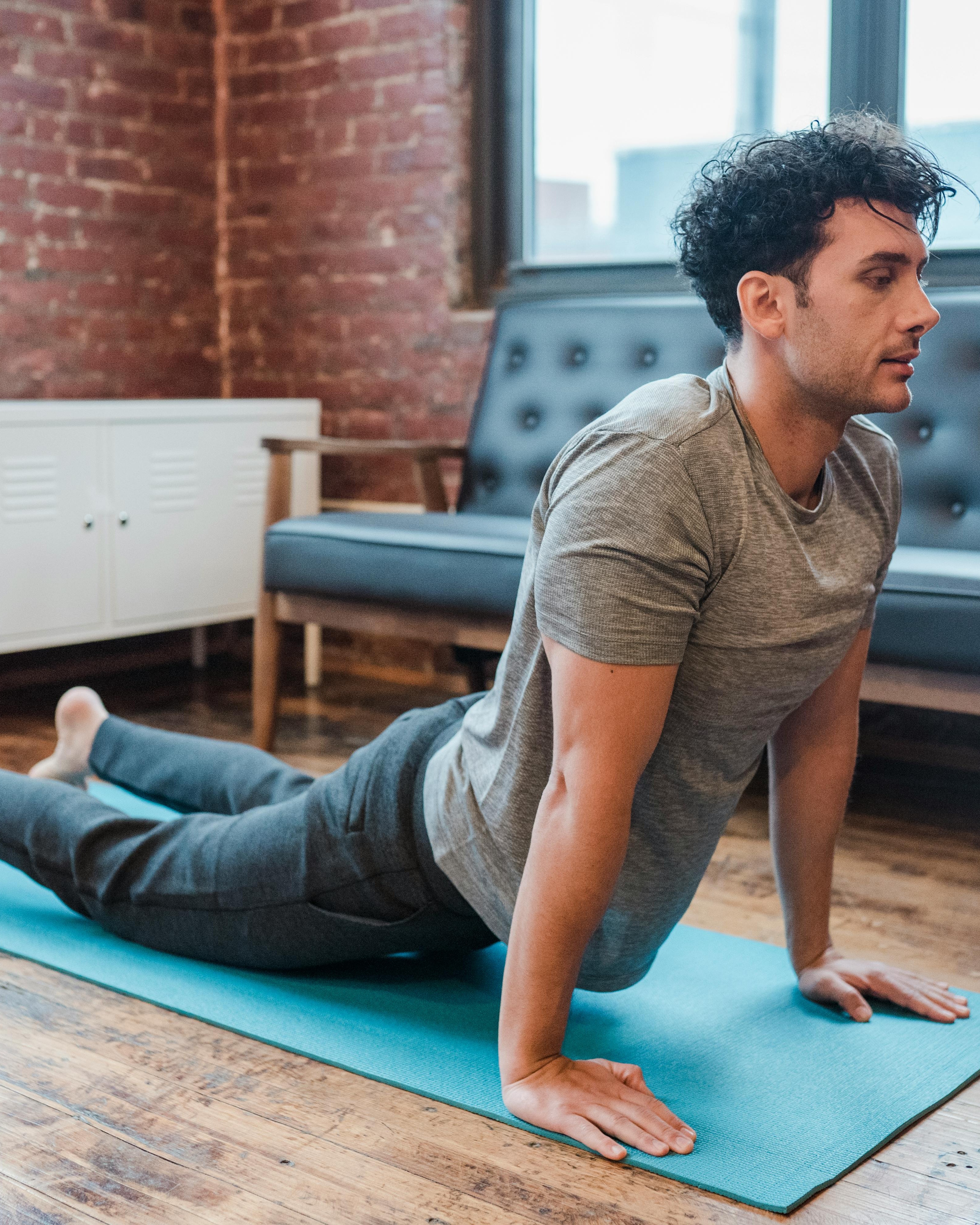 Man Practicing Cobra Yoga Pose Indoors