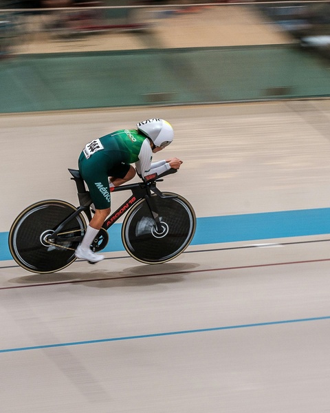 Mexican Track Cyclist Racing on Velodrome