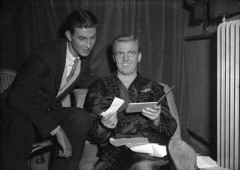Two Men Reviewing Papers