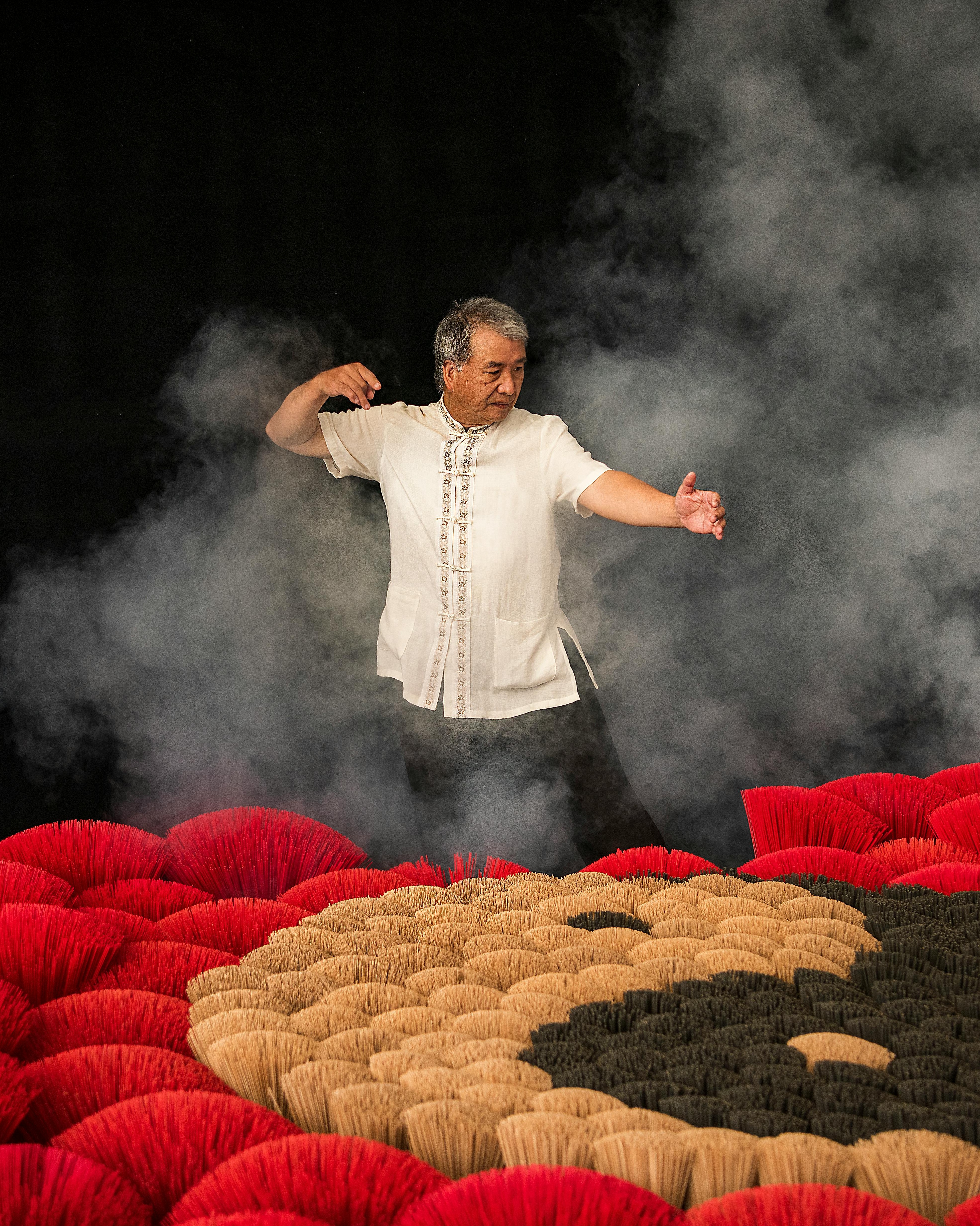 Man Practices Tai Chi Amid Drying Incense