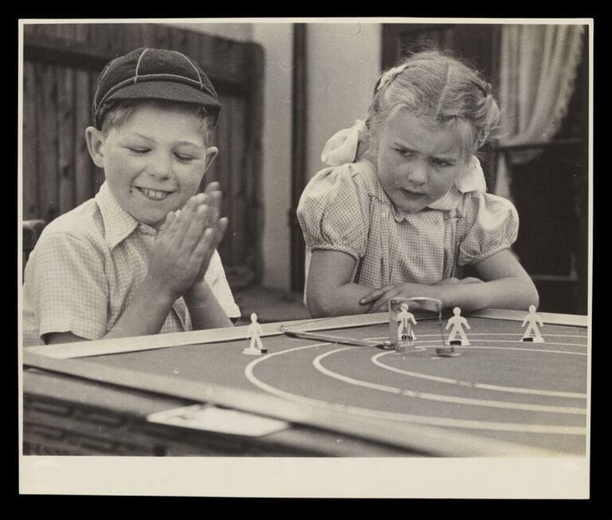 Two Children Playing Board Game