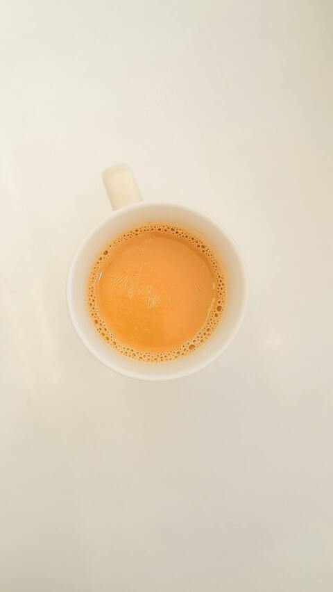 Top-Down View of Milk Tea in White Mug