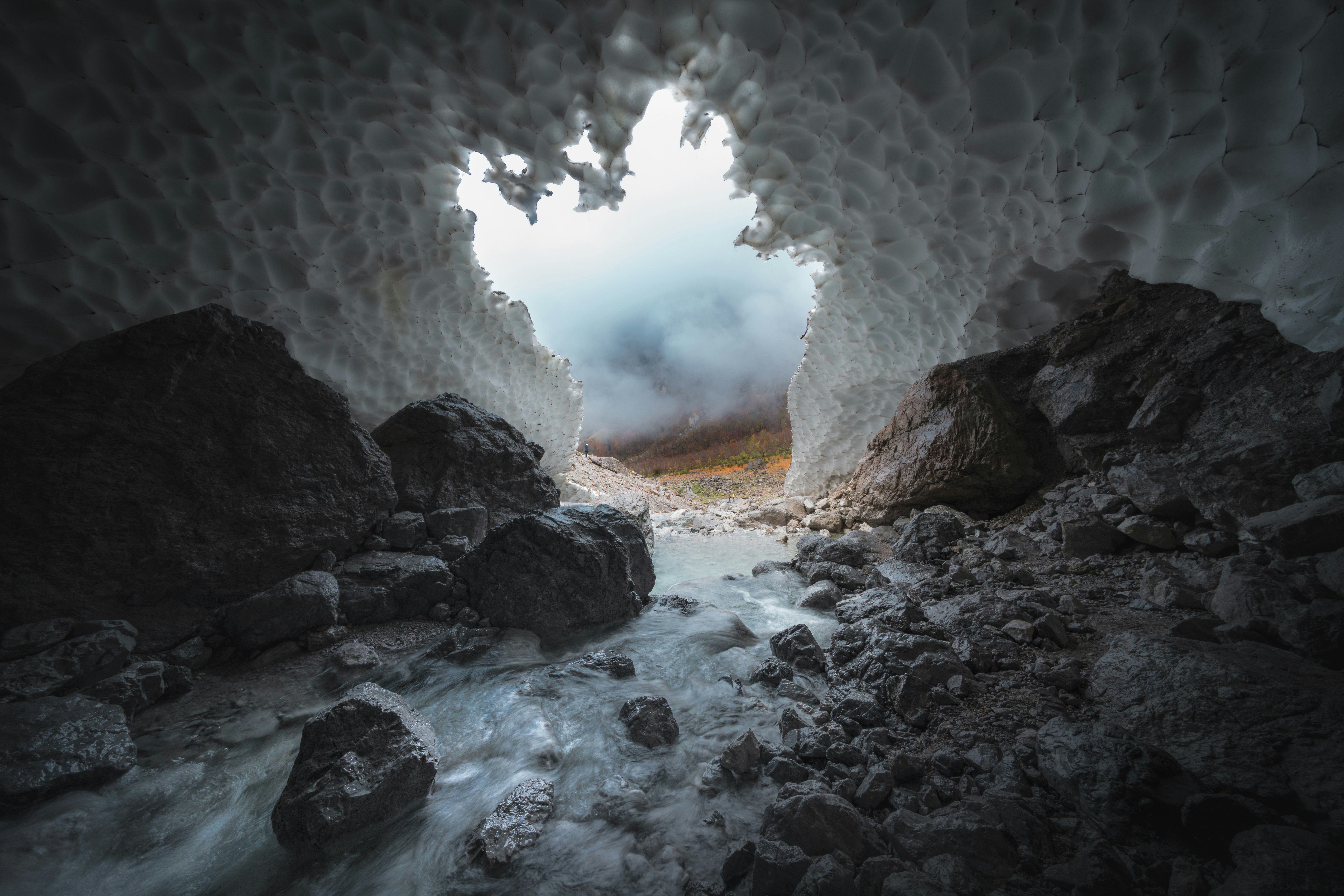 Ice Cave With Flowing Stream