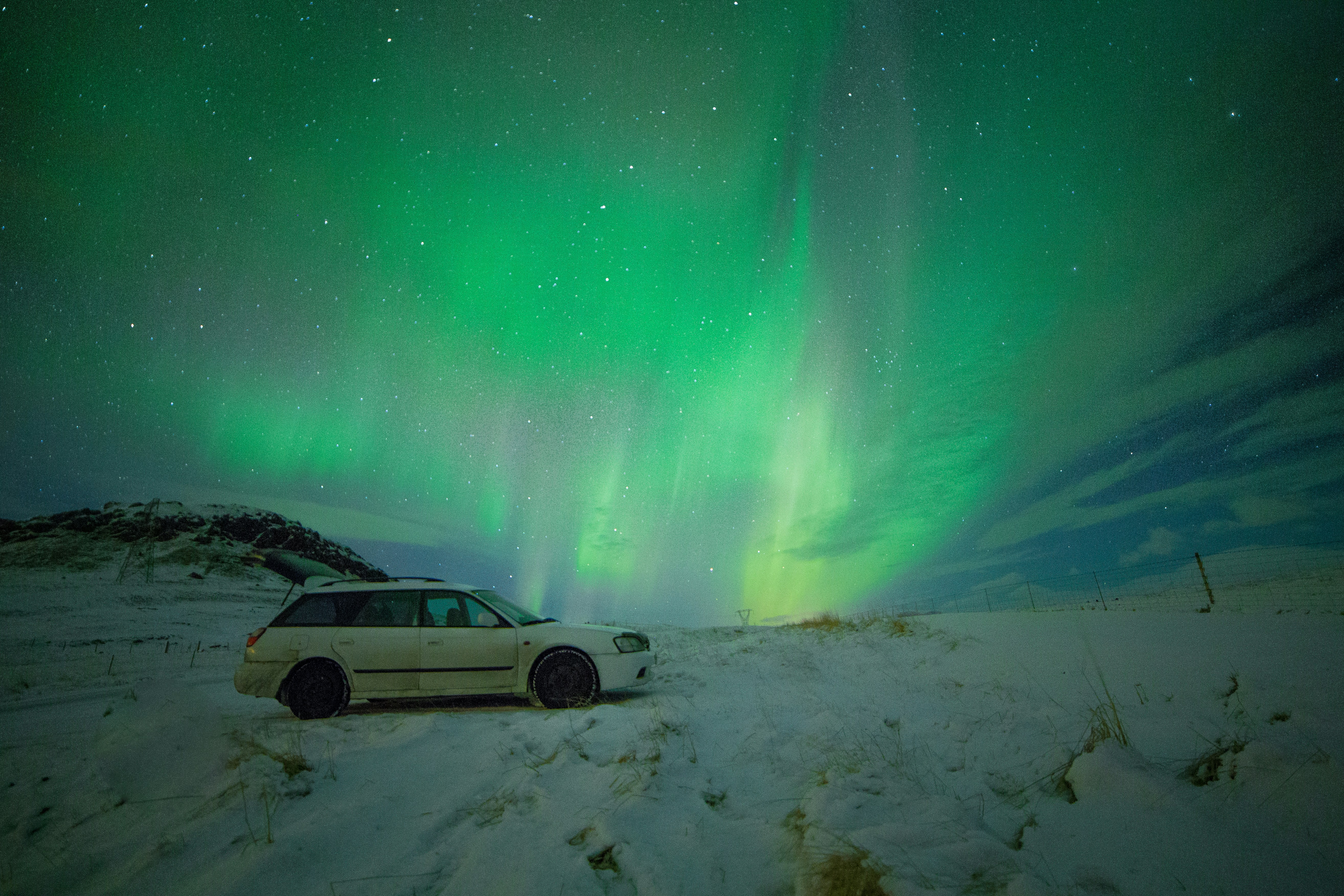 Parked Car Under Northern Lights