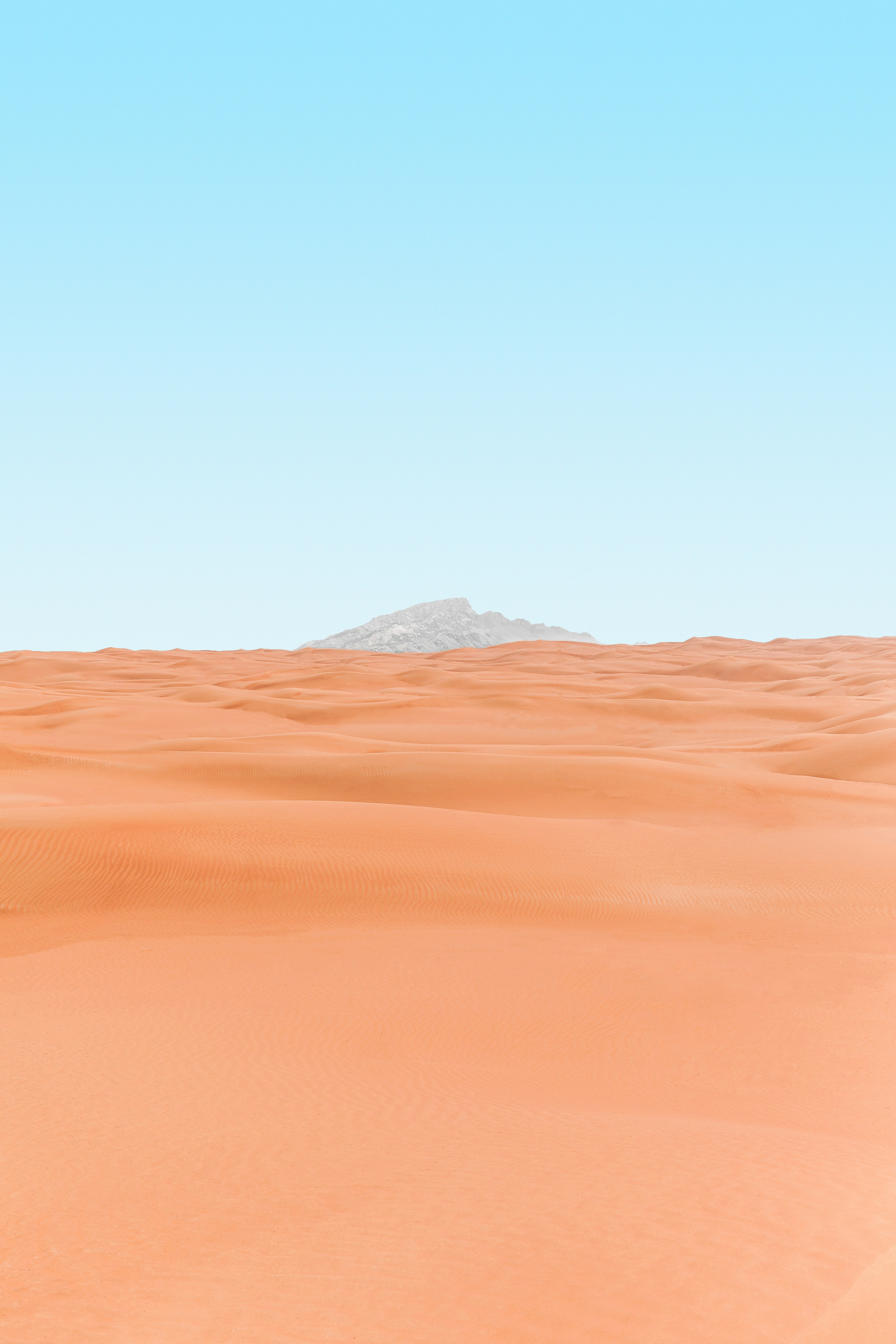 Desert Sand Dunes with Distant Peak