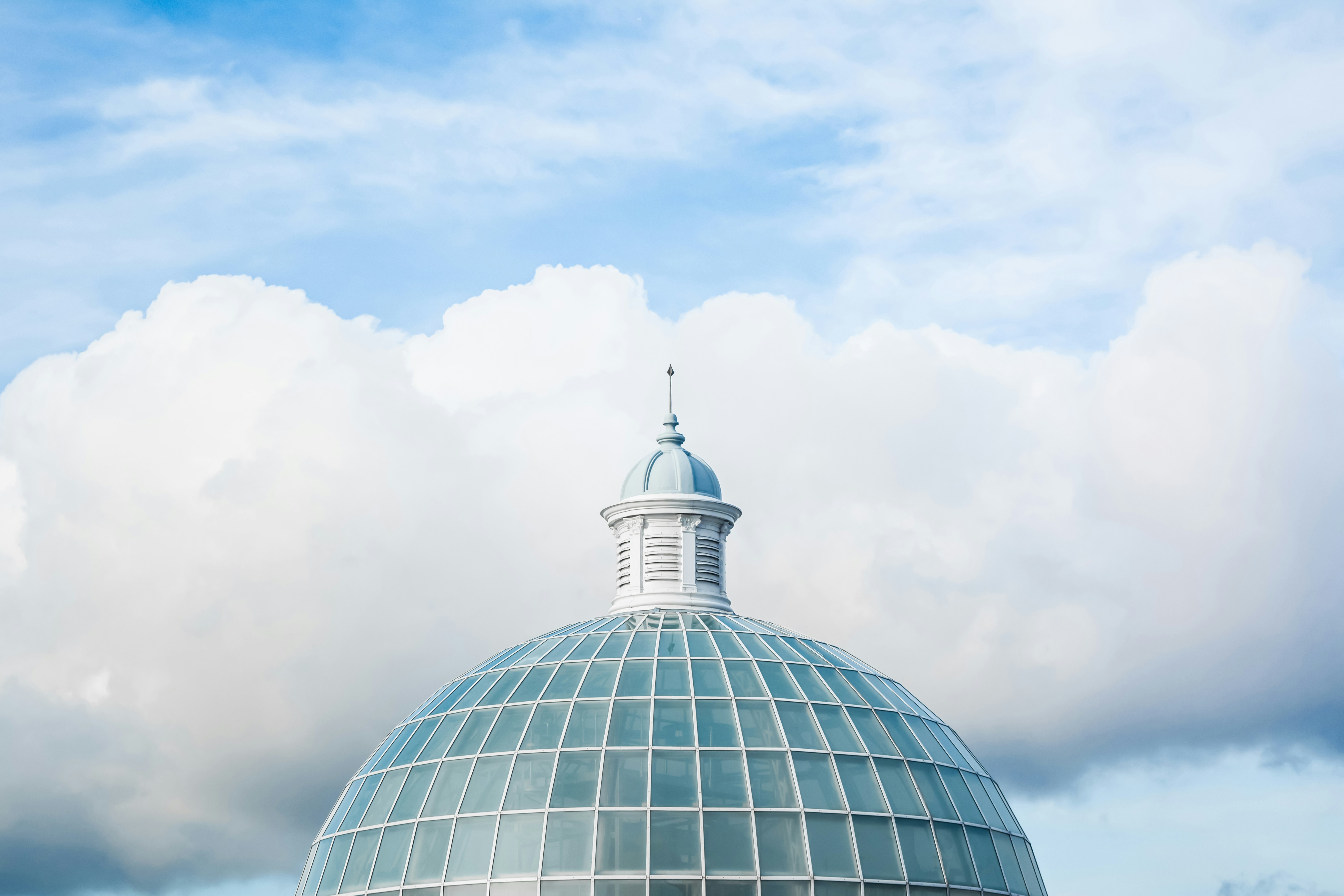 Glass Dome Against Cloudy Sky
