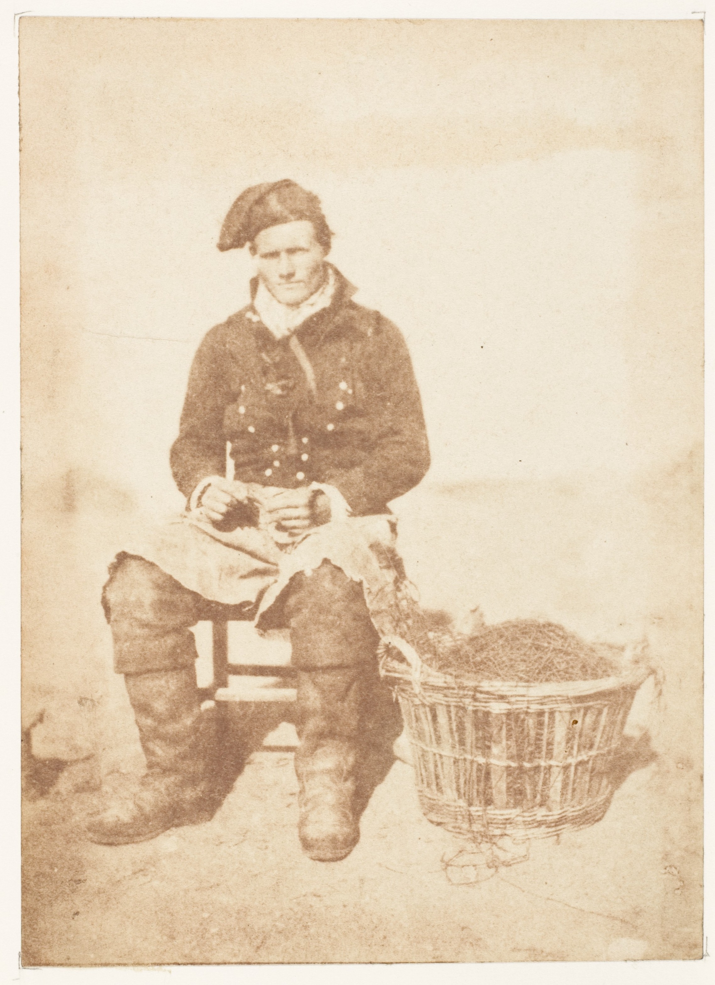 Working Fisherman Mending Nets