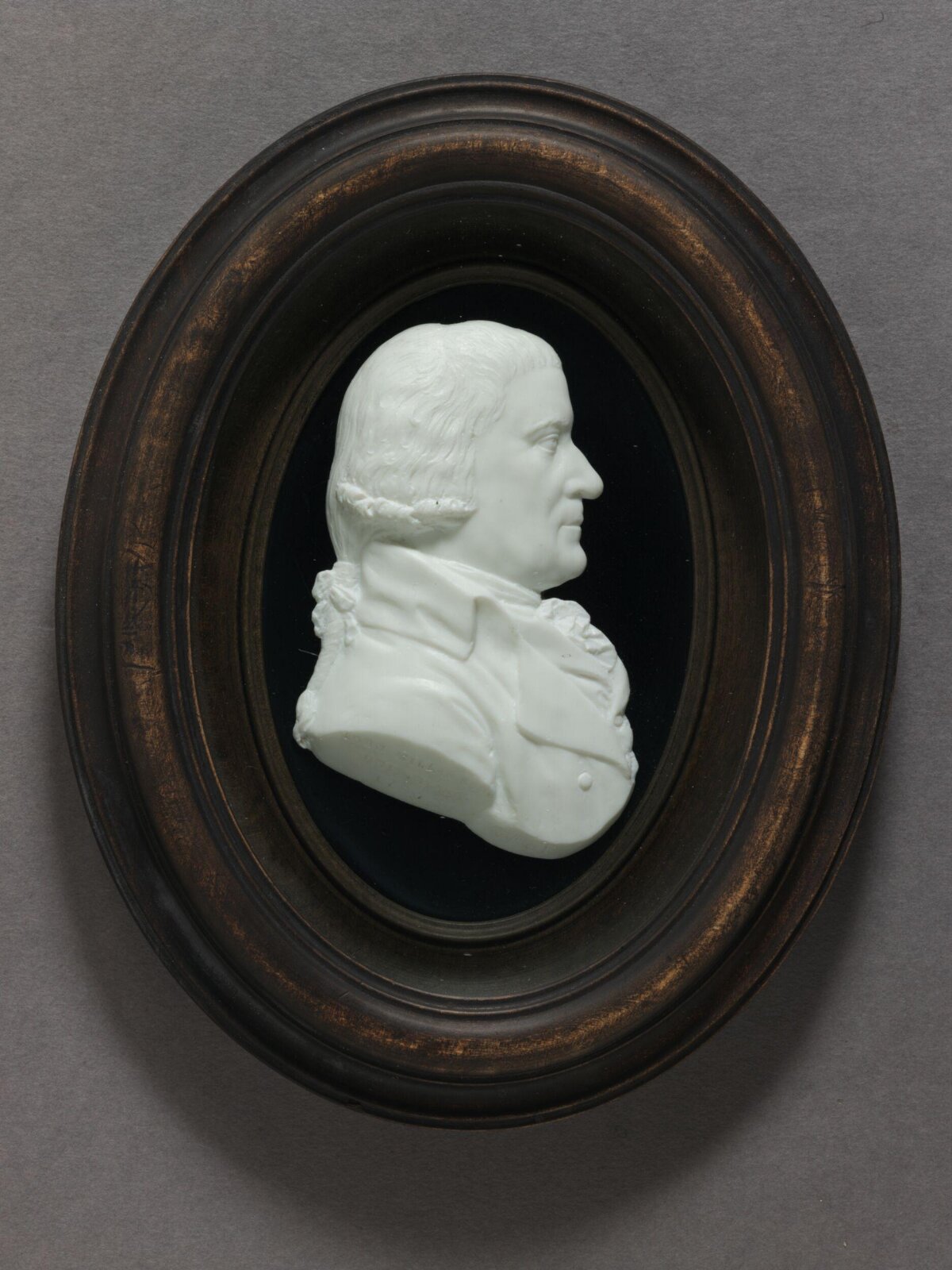 Oval Framed Male Portrait Relief