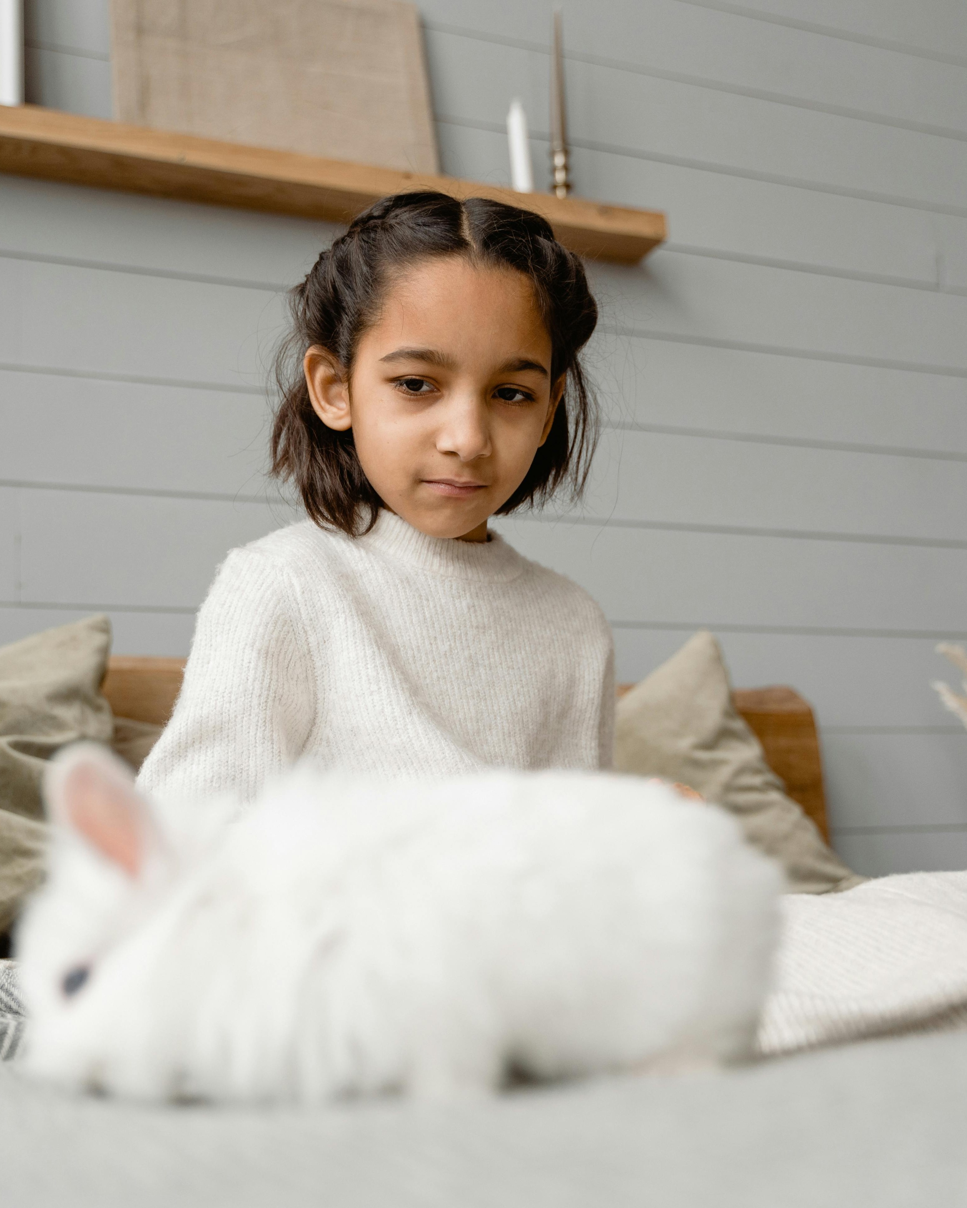 Girl and White Rabbit in Bedroom