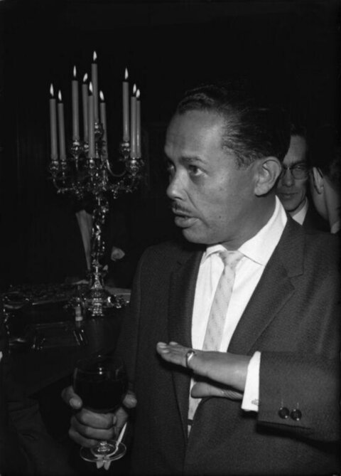 Man at Formal Dinner Holding Wine Glass