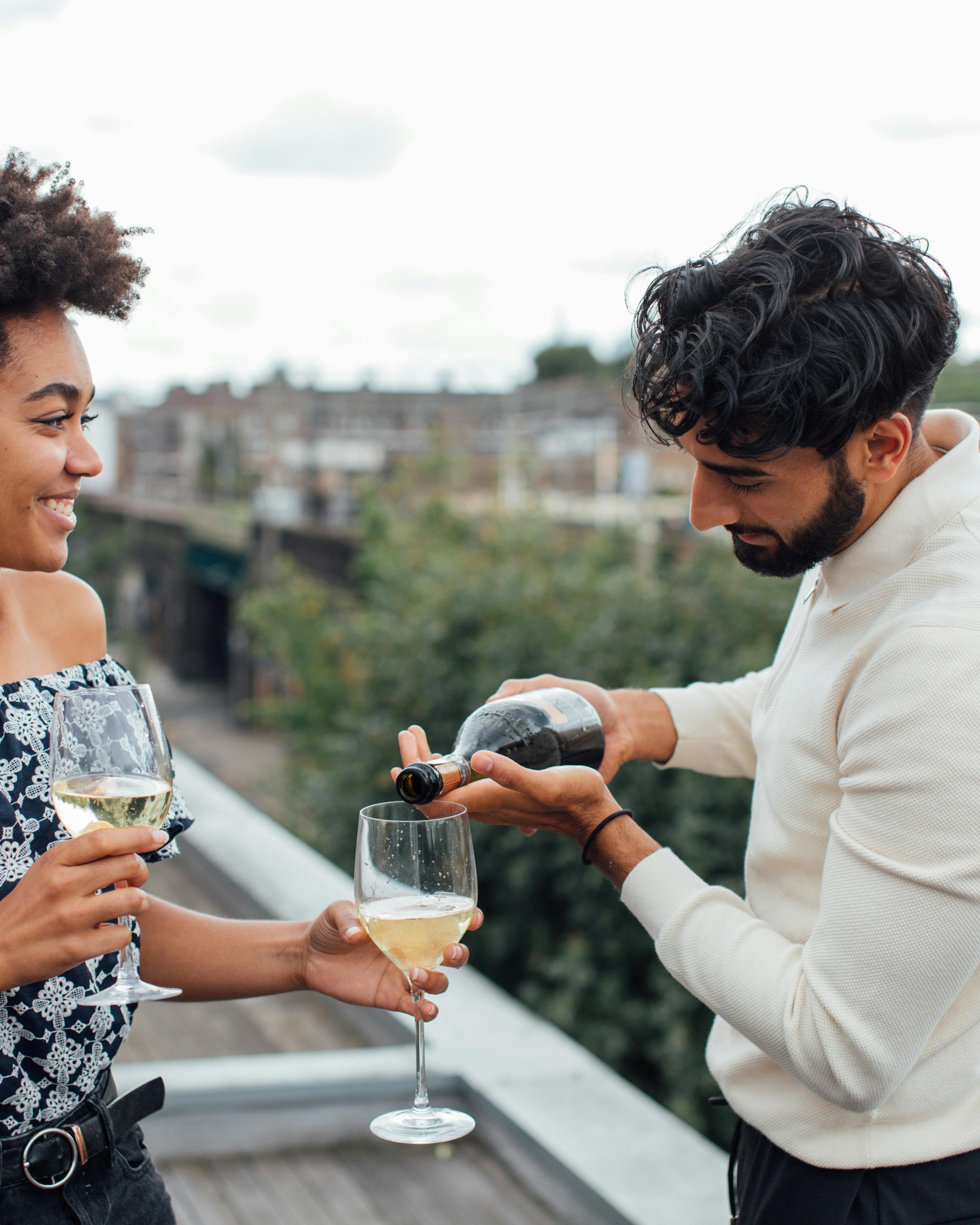 Couple Enjoying Wine on Rooftop